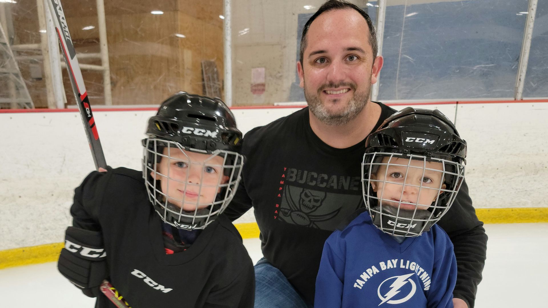 Kevin goodwin and his kids in their hockey gear