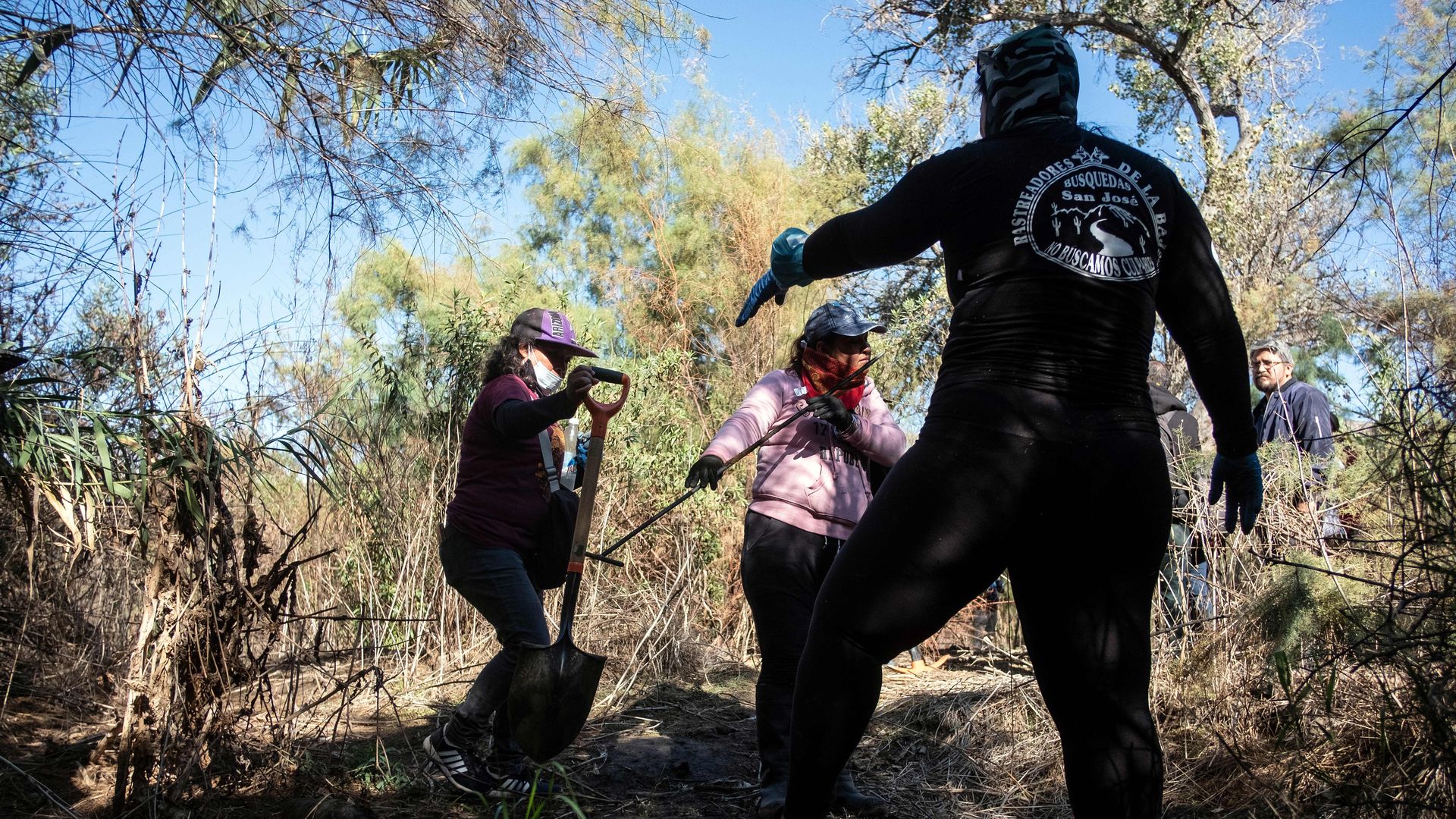 Women dig in a field near Tijuana in search of remains of forcibly disappeared people, November 2019. Photo: Guillermo Arias/AFP  via Getty Images