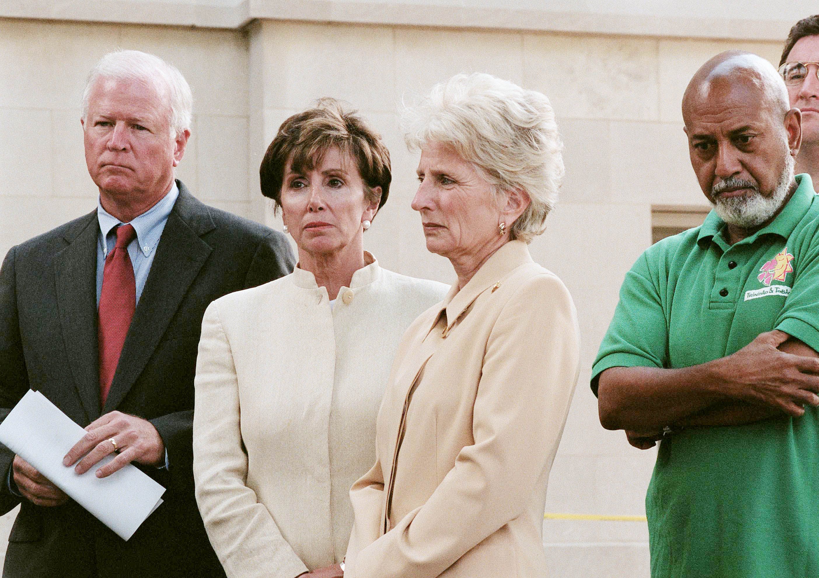 Members of Congress, looking solemn, stand outside Capitol Police Headquarters on Sept. 11, 2001, during a press event.