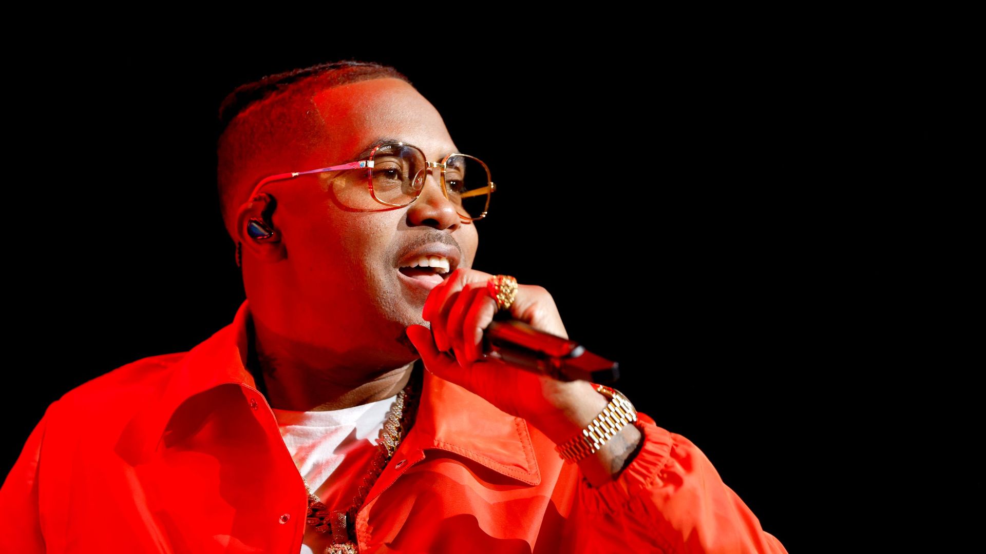 Nas is seen performing. 