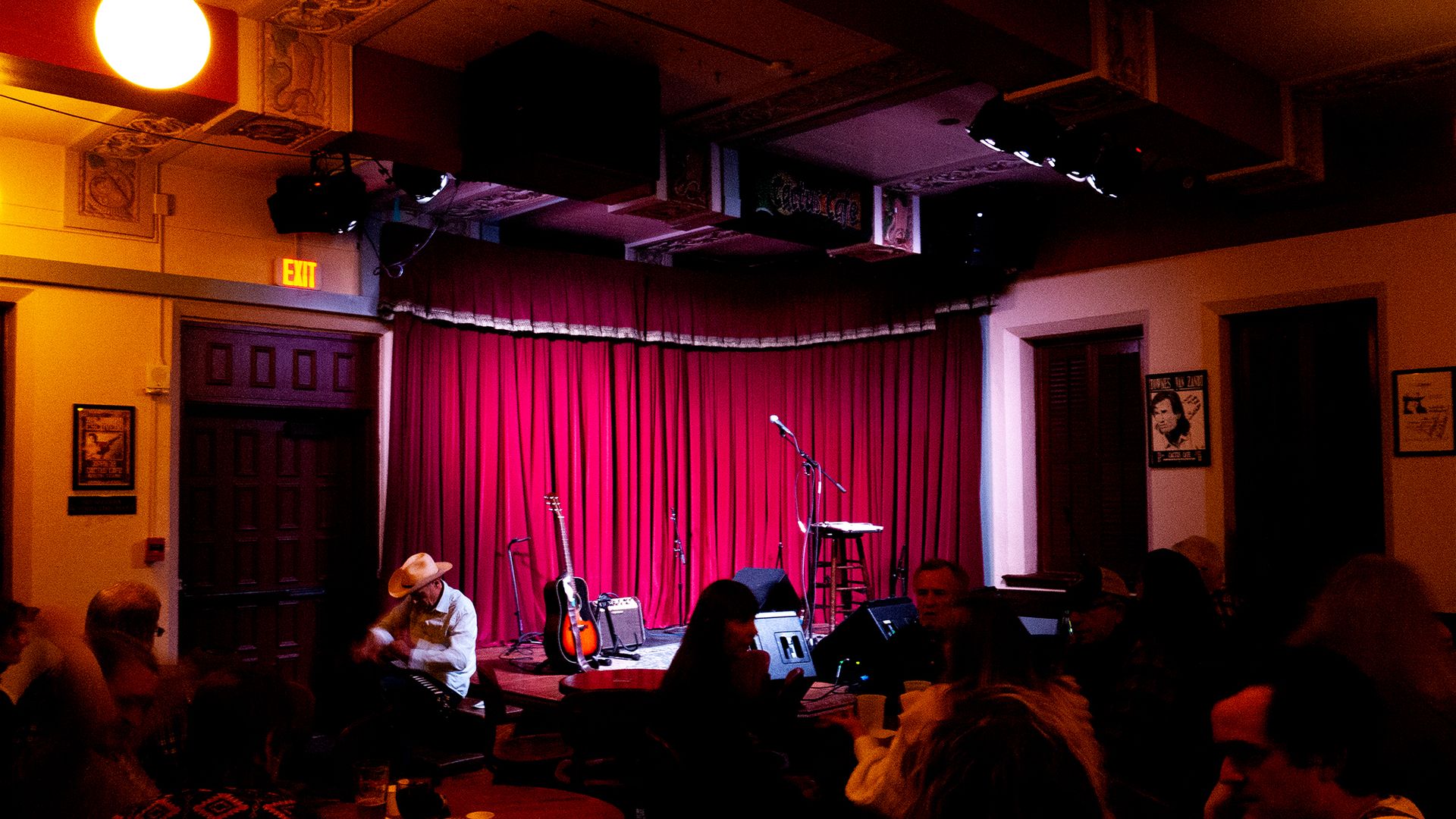 A photo of a stage with a crowd in front
