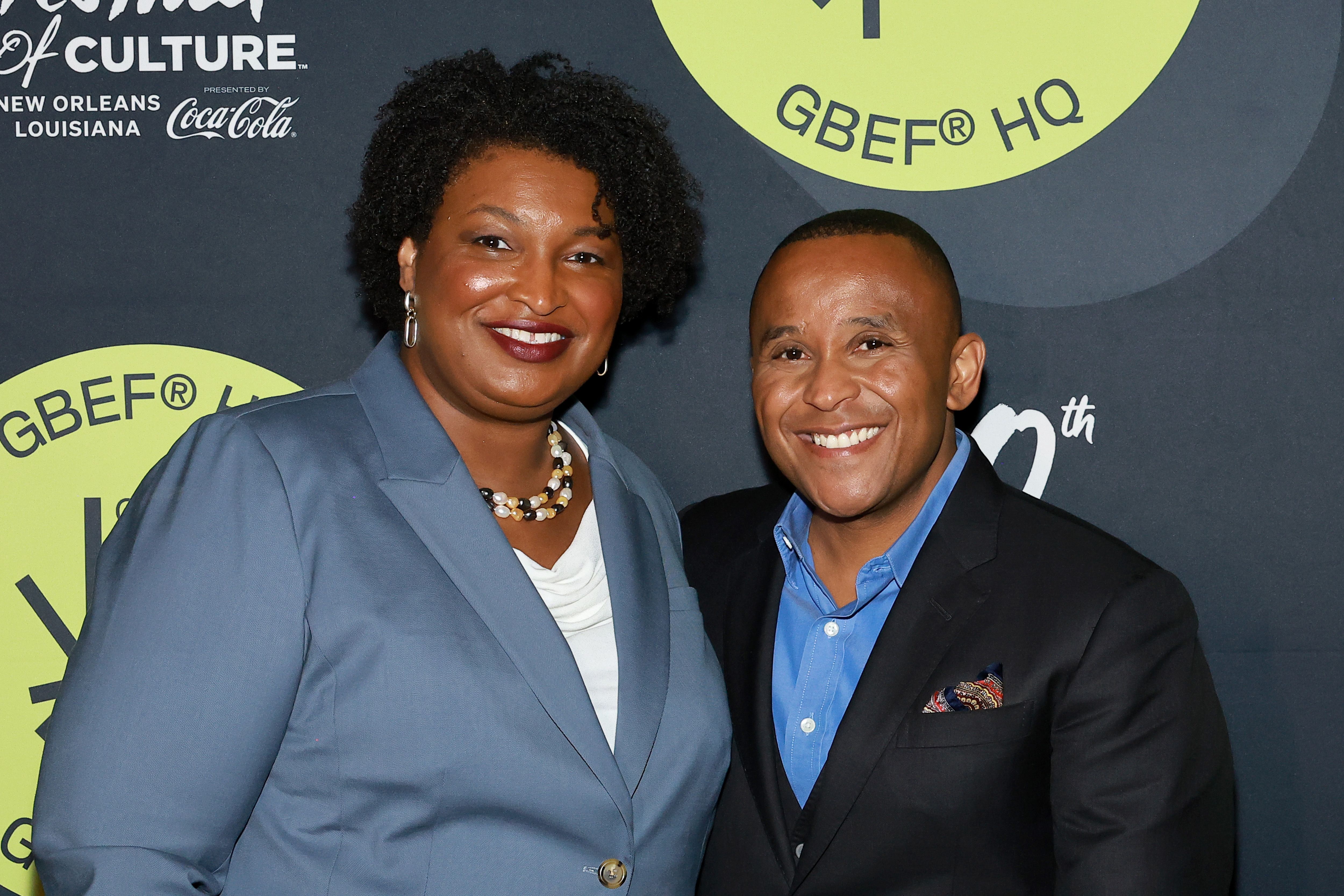 Stacey Abrams and Rashad Robinson pose at Essence