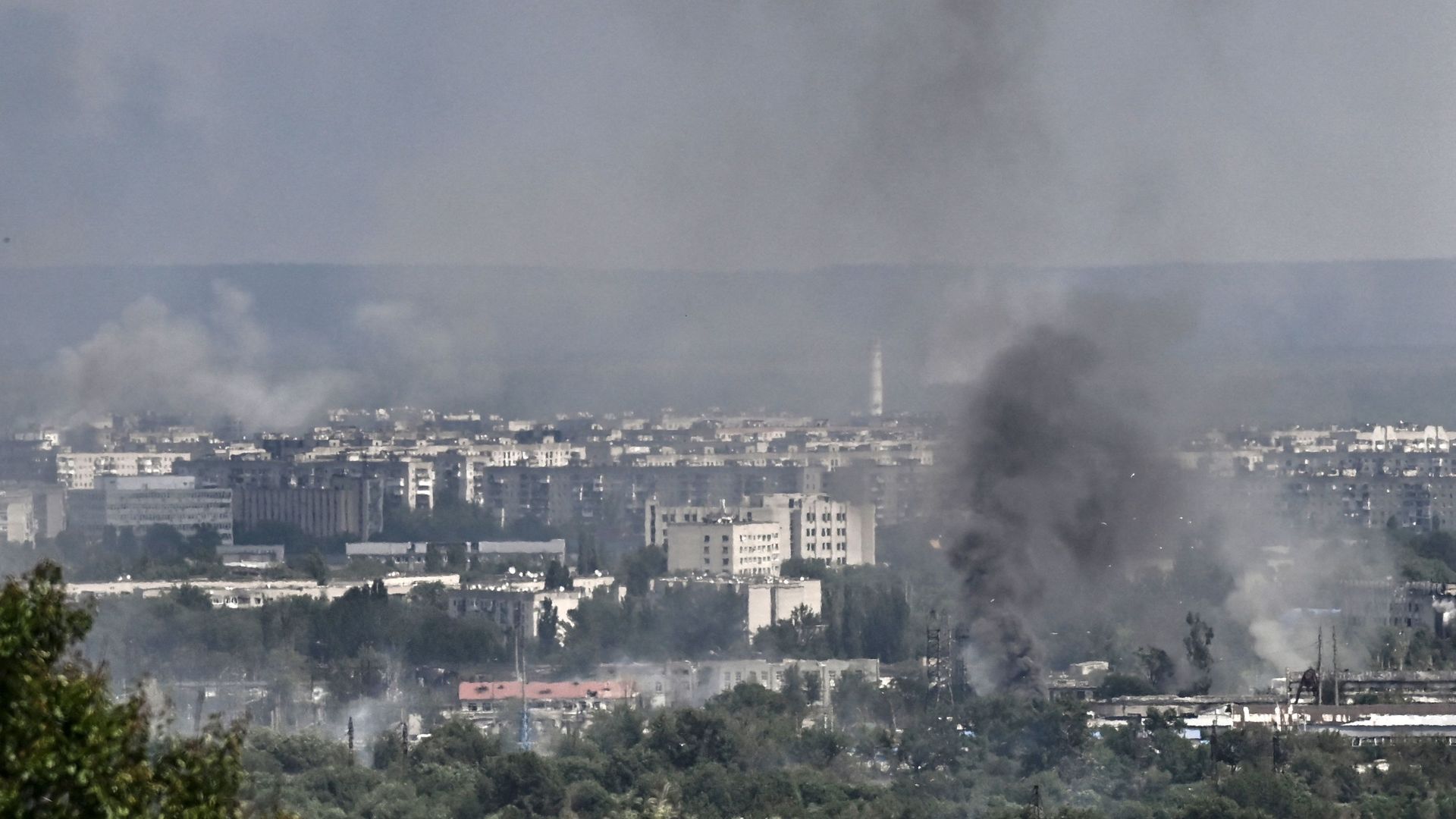 Smoke and dirt rise from the city of Severodonetsk