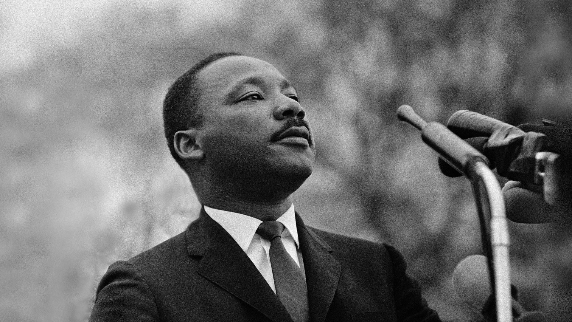 Martin Luther King Jr. at a microphone