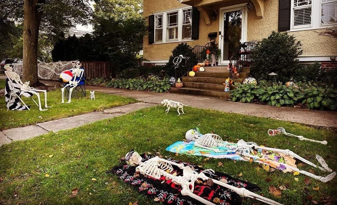 Photo of skeletons on lawn 
