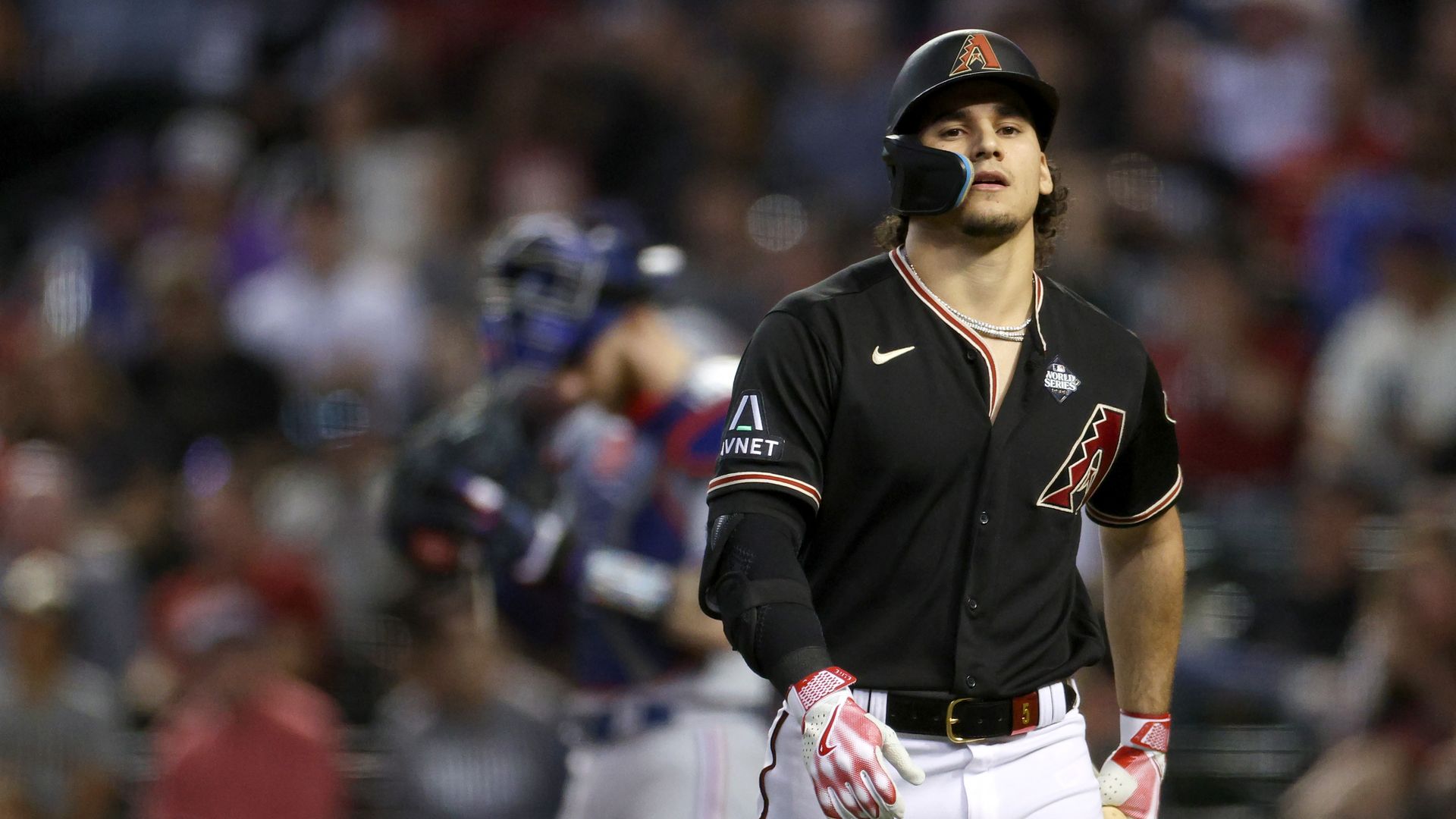 Alek Thomas #5 of the Arizona Diamondbacks walks back to the dugout after striking out in the seventh inning against the Texas Rangers during Game Four of the World Series at Chase Field on October 31, 2023 in Phoenix, Arizona.