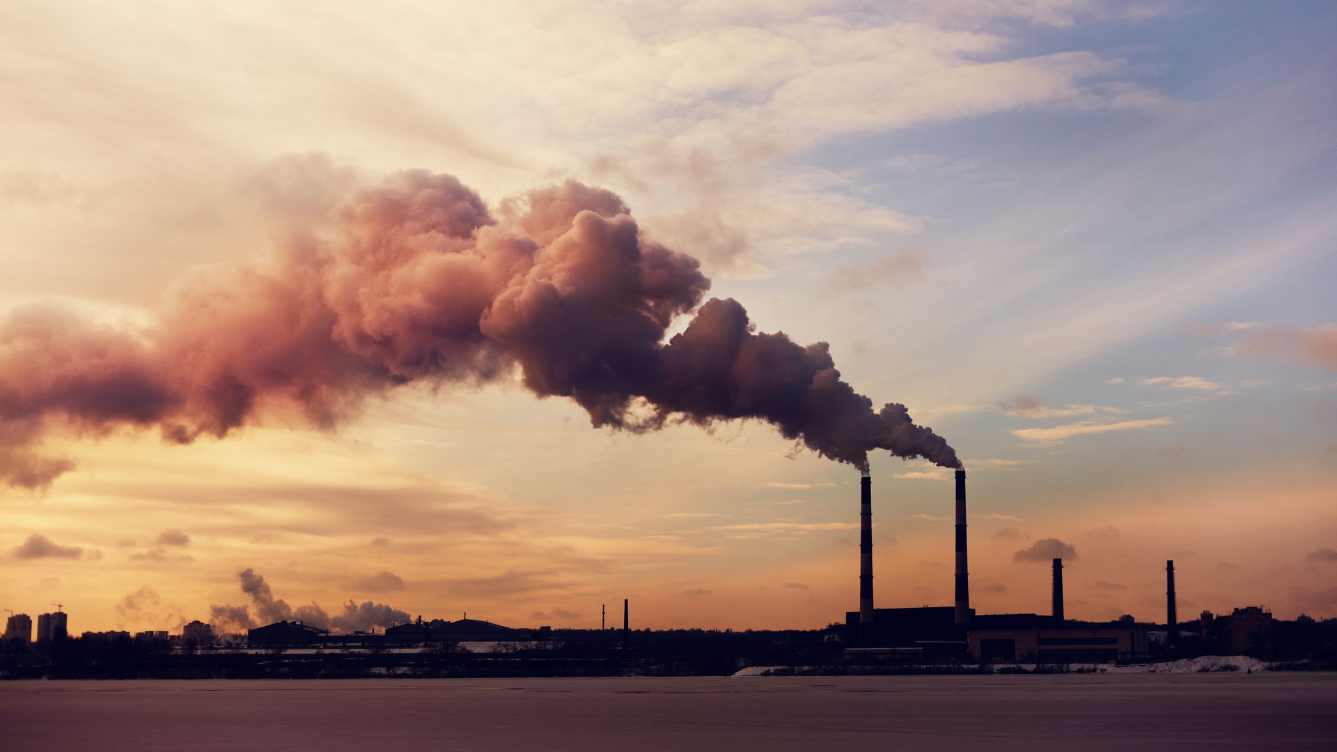 Chimney stacks emitting smoke.