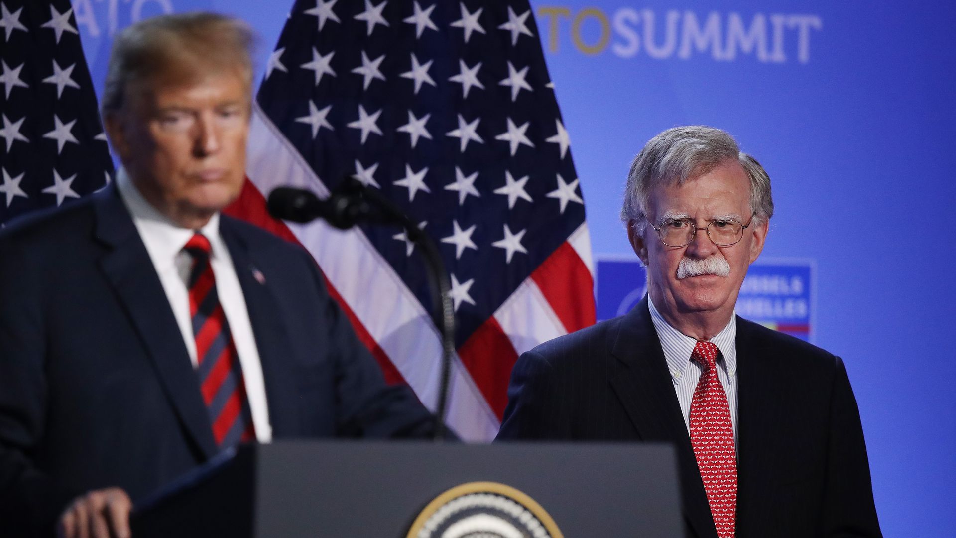 President Trump, flanked by National Security Advisor John Bolton, speaks to the media at a press conference on the second day of the 2018 NATO Summit on July 12, 2018 in Brussels, Belgium 
