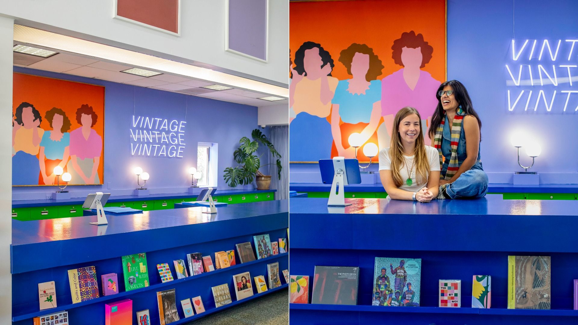 Two smiling women seated at a blue counter in a colorful vintage shop with a neon sign reading "VINTAGE" in blue, an orange and blue mural of three women, and books displayed below the counter.