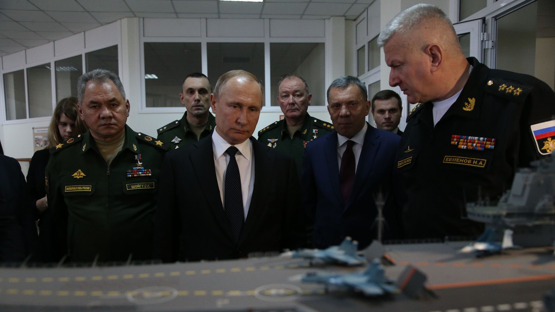 Putin with military officials in Crimea