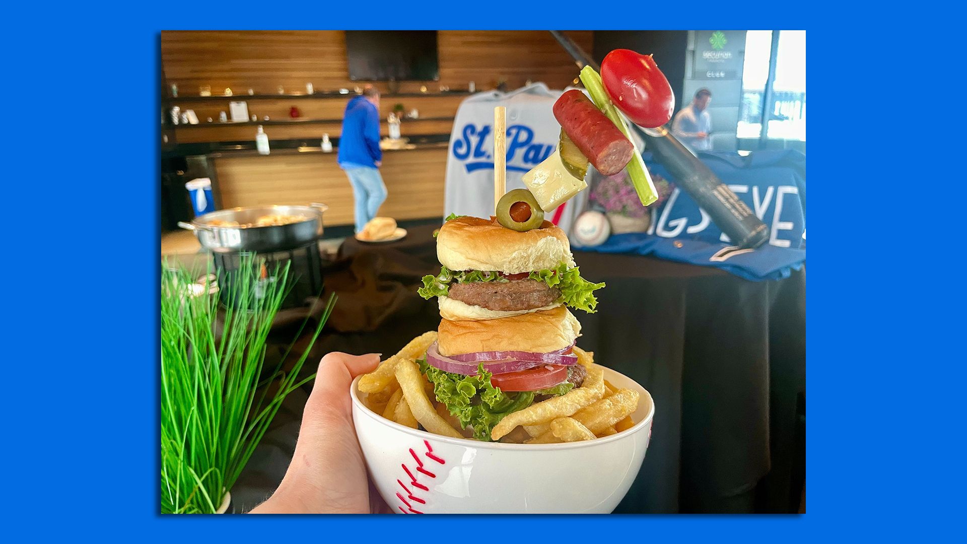 three sliders stacked on top of each other in a bowl of fries