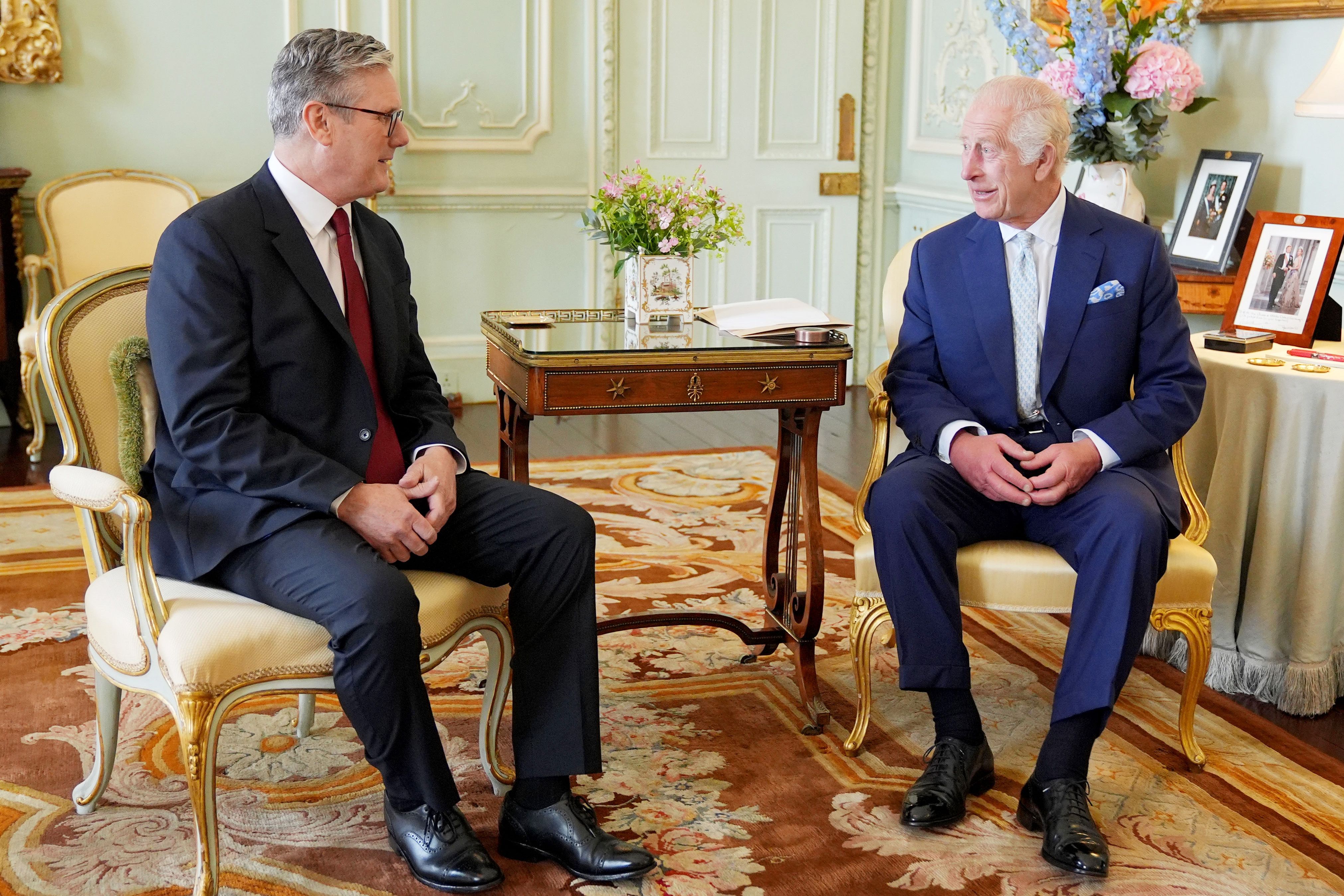 King Charles III welcomes Sir Keir Starmer during an audience at Buckingham Palace