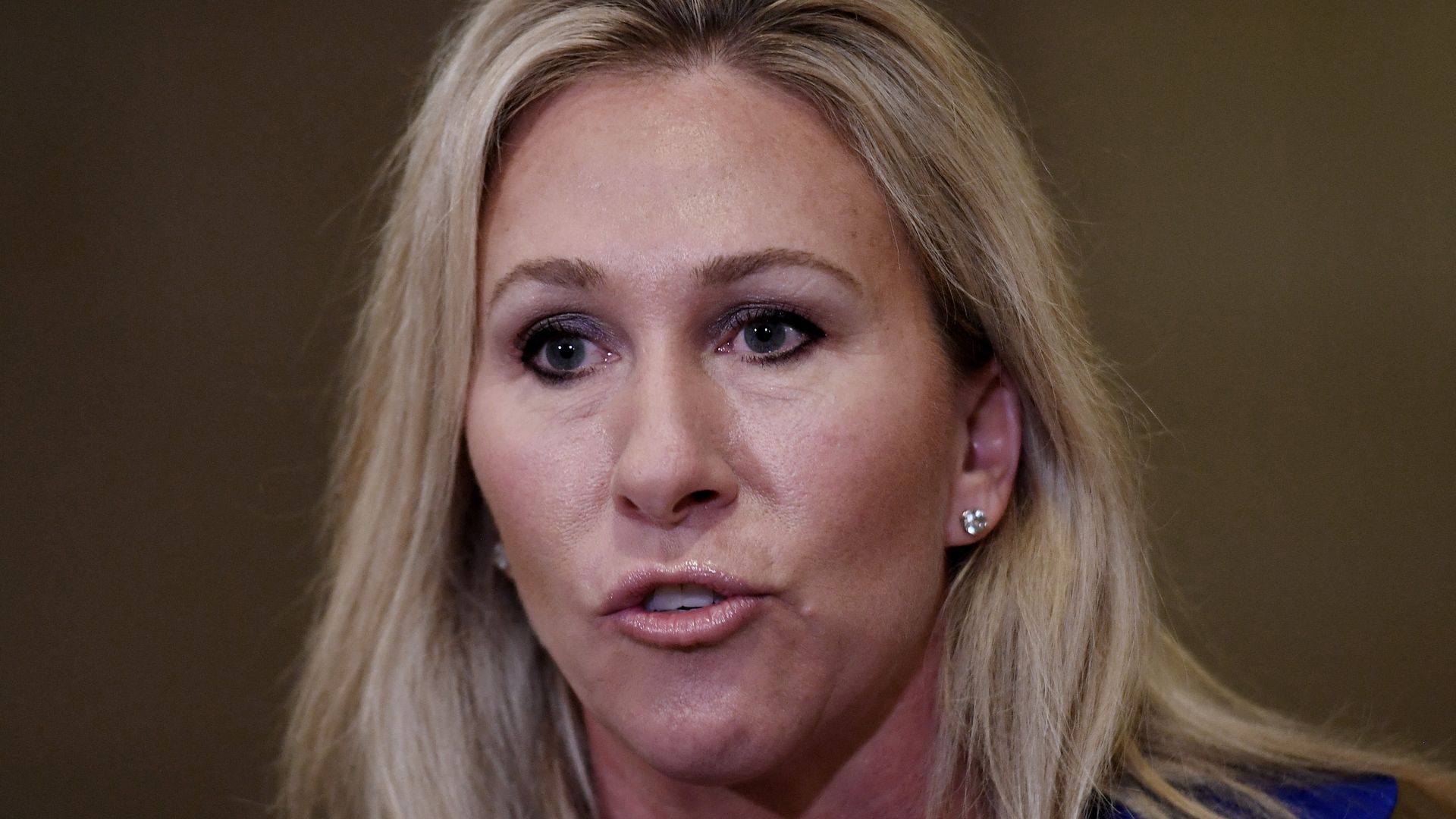 Marjorie Taylor Greene is seen speaking.