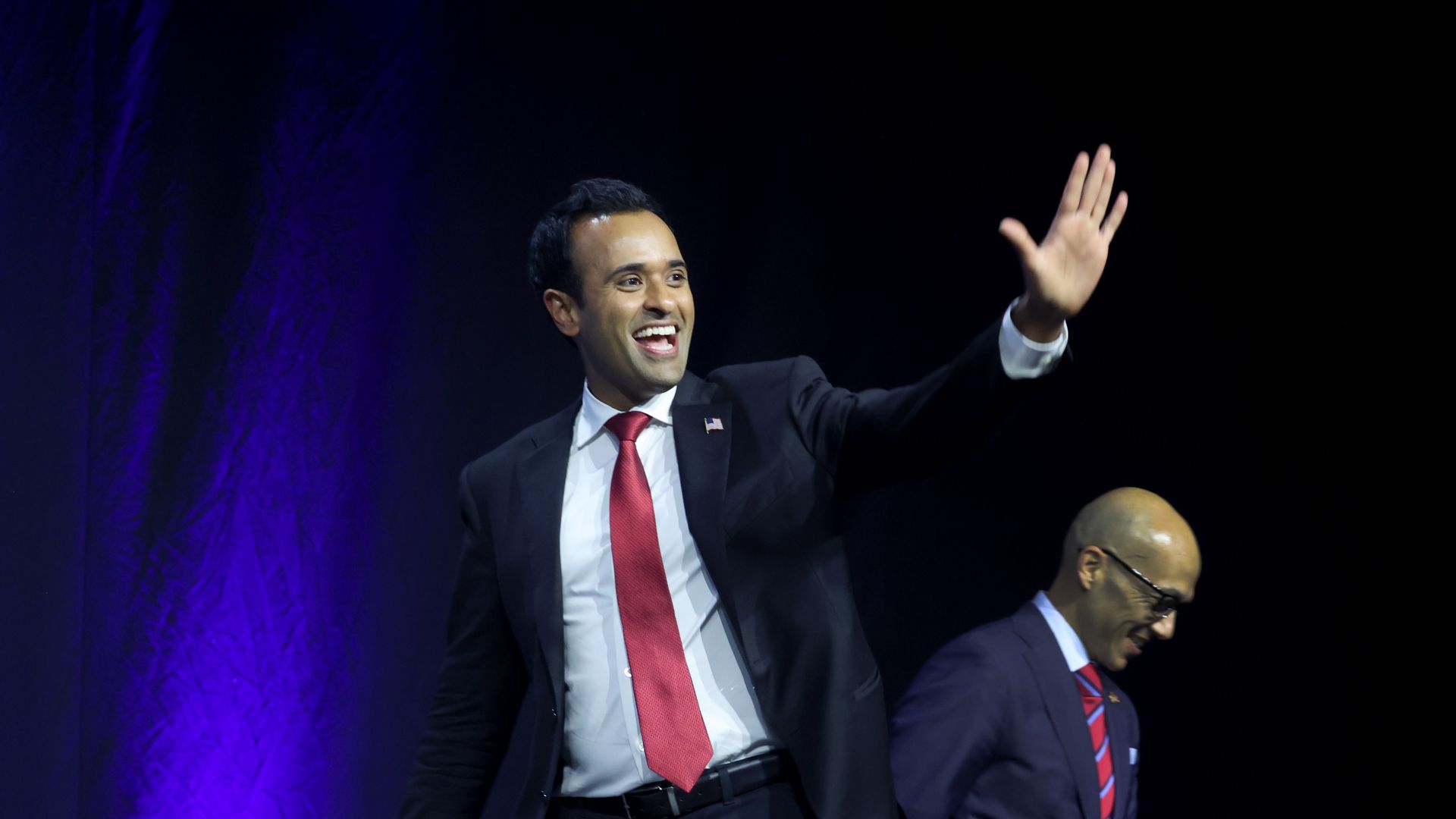 Republican presidential contender Vivek Ramaswamy waves to a crowd in Des Moines, Iowa.
