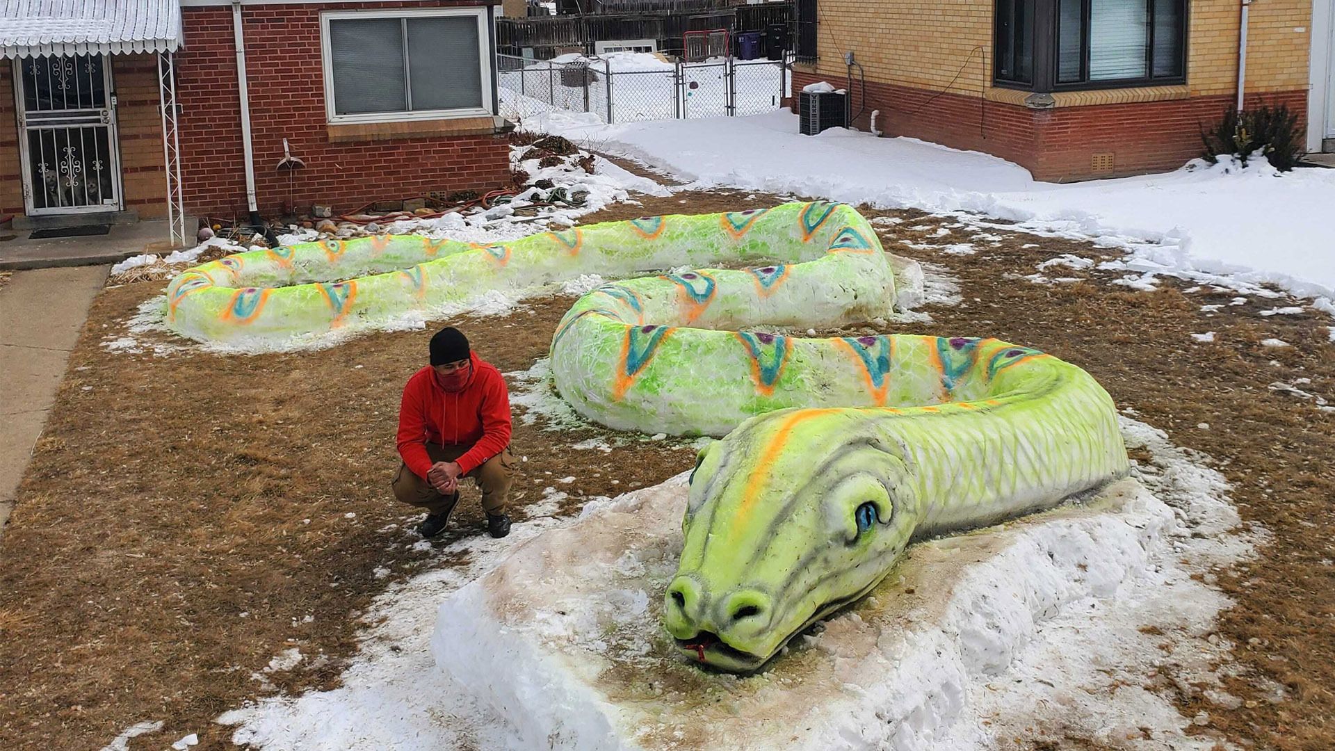 Morn Mosley II and his snake snow sculpture.