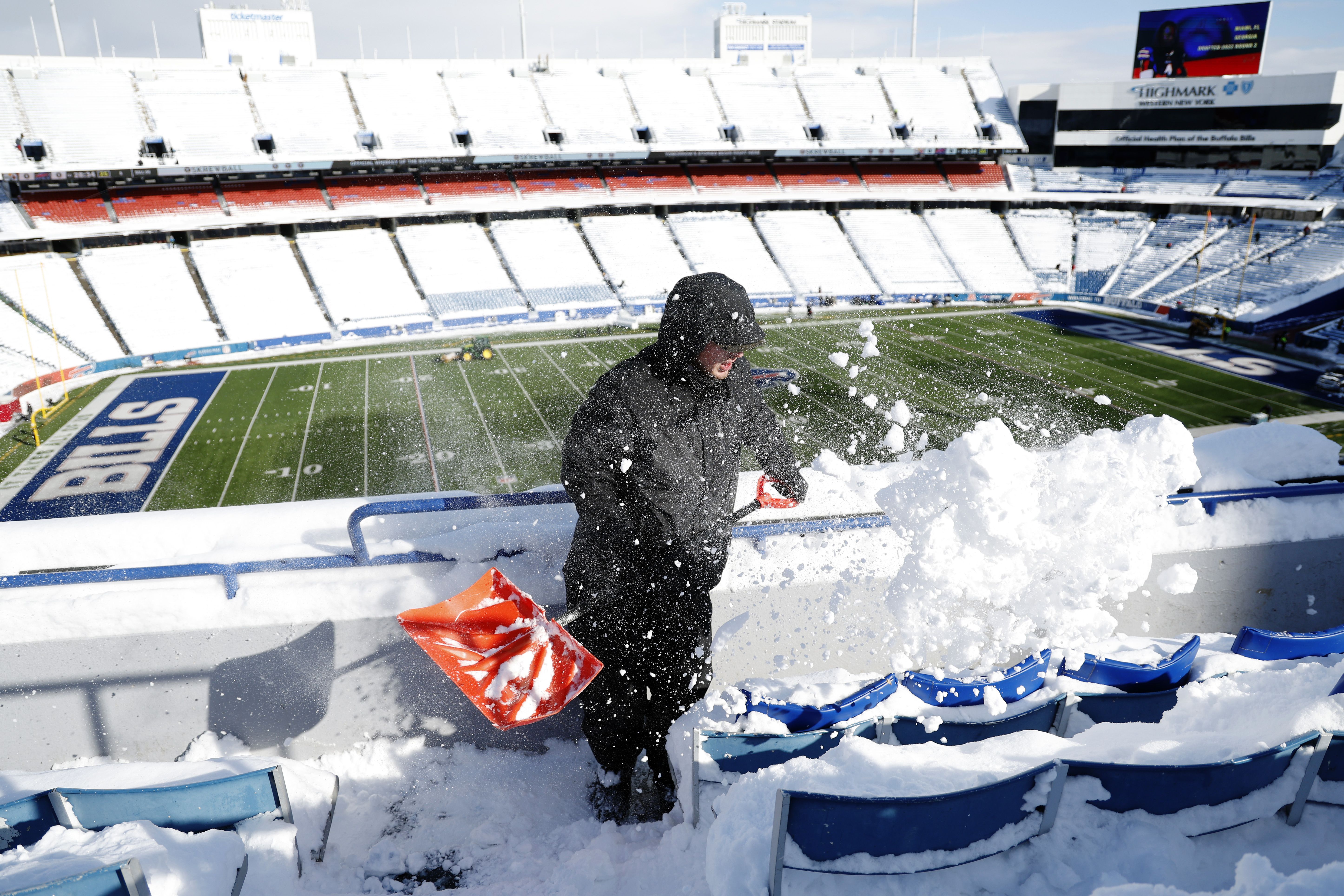  Bryan Bremer shovels snow before the AFC Wild Card playoff game between the Buffalo Bills and Pittsburgh Steelers at Highmark Stadium on January 15, 2024 in Buffalo, New York. 