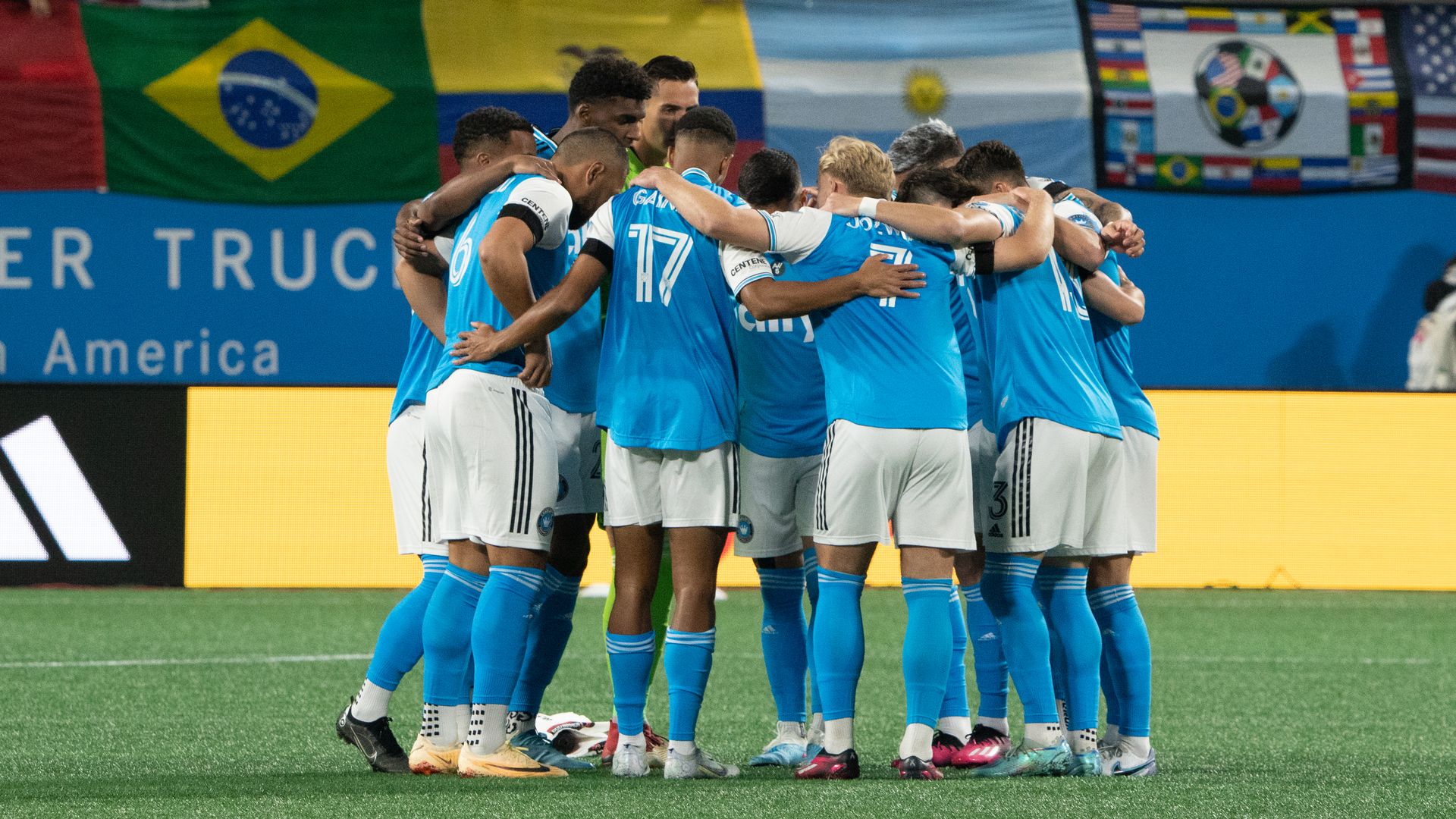 Charlotte FC players huddle up during the home opener at Bank of America Stadium.