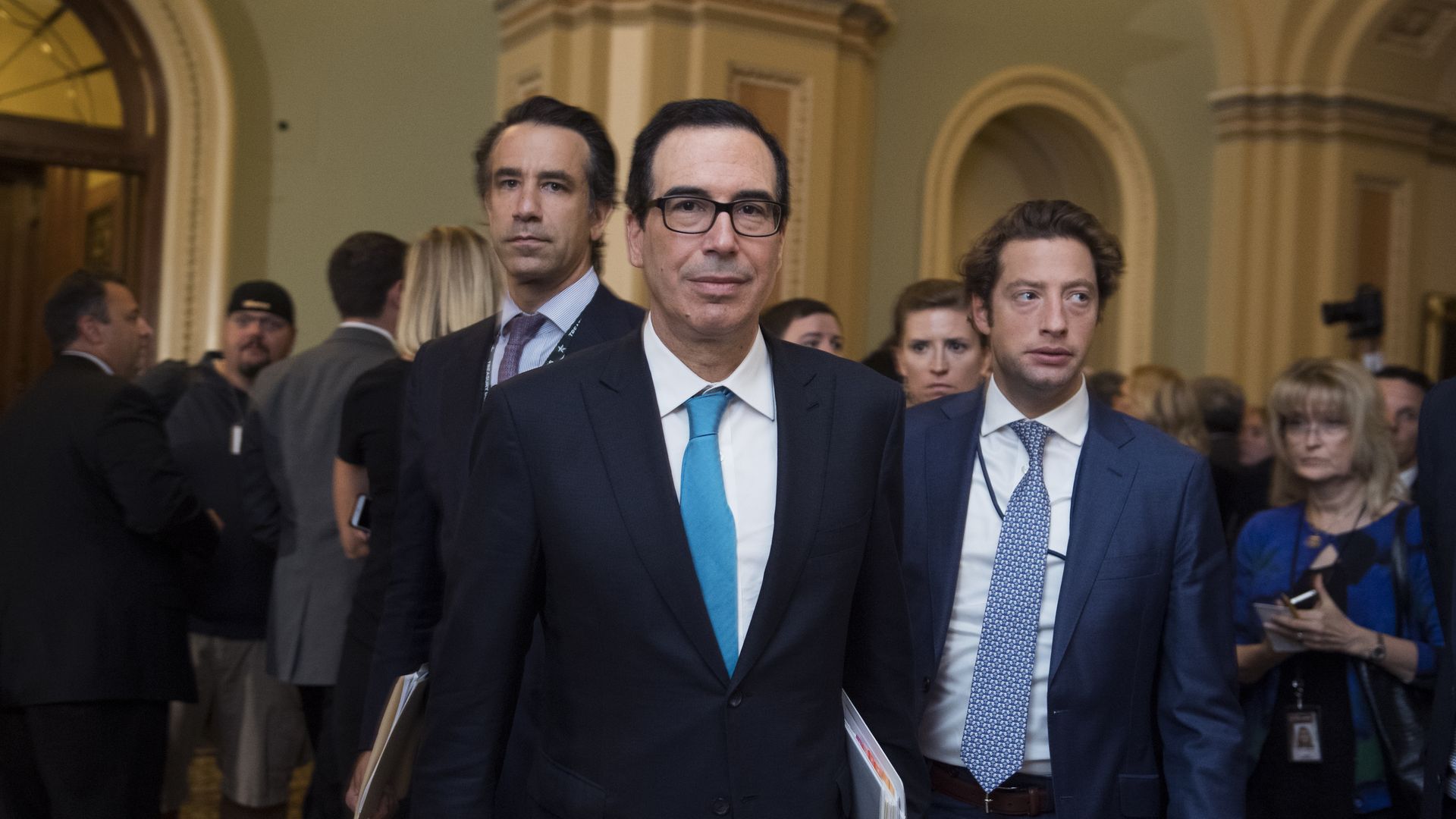Treasury secretary Steven Mnuchin wearing black suit. 
