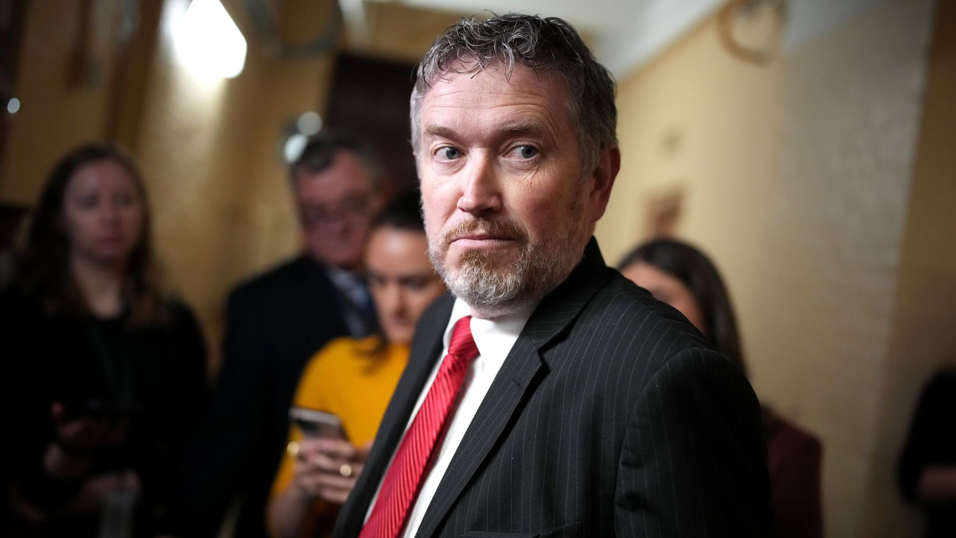 U.S. Rep. Thomas Massie (R-KY) speaks to reporters as she arrives for a House Republican caucus meeting 