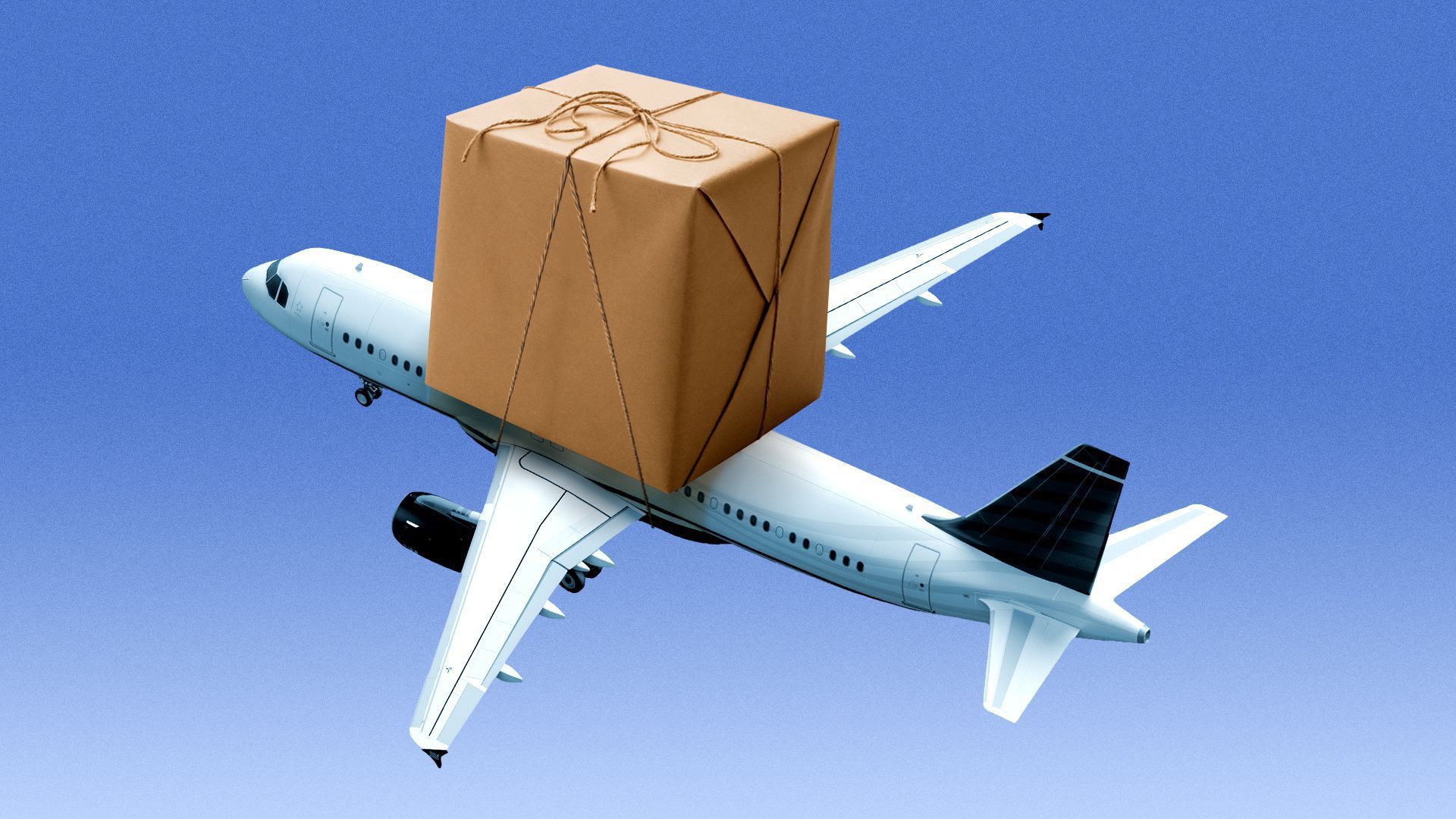 An airplane with a package strapped on top