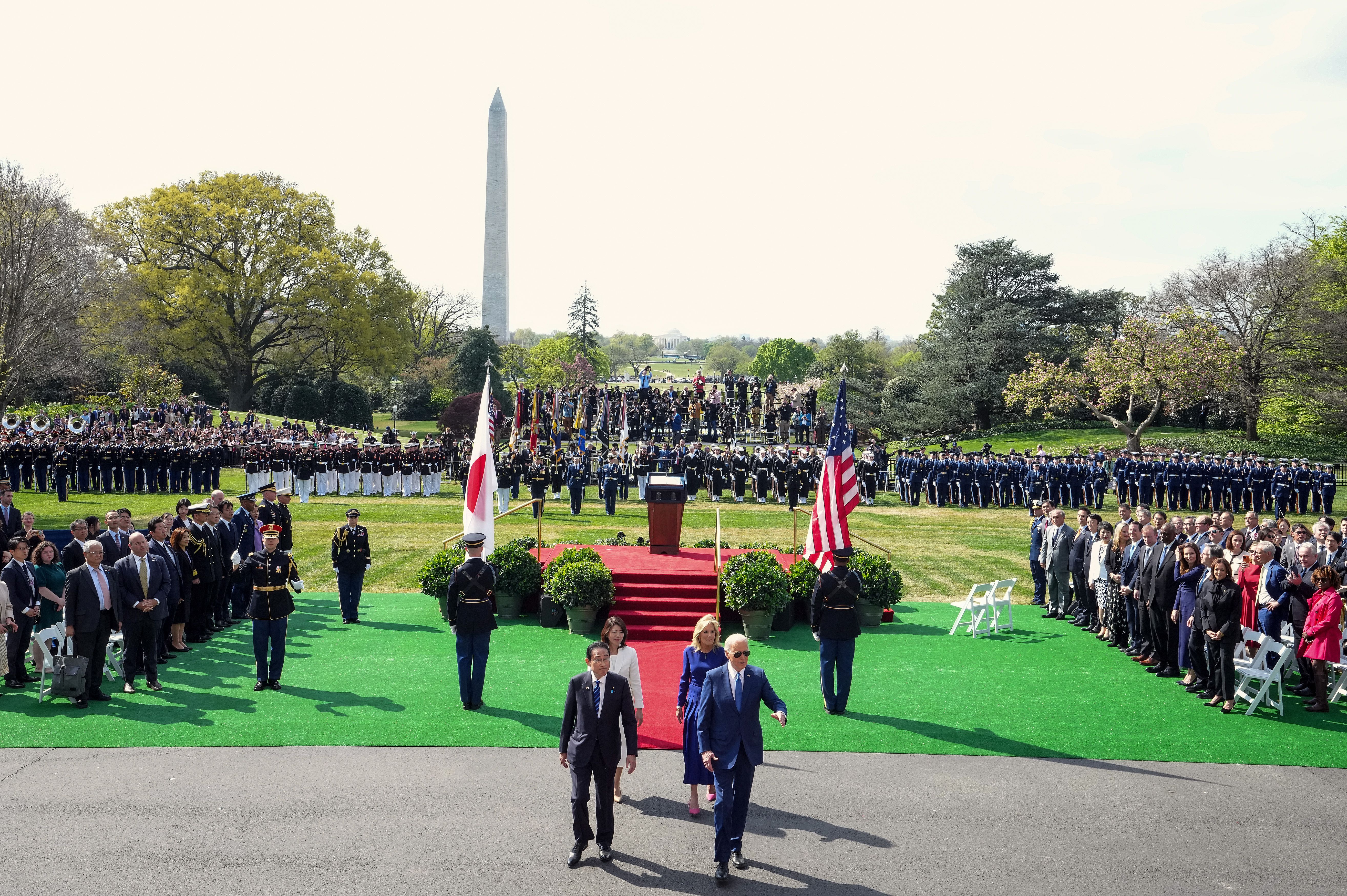 President Joe Biden (R) and Japanese Prime Minister Fumio Kishida leave the stage at the conclusion of an arrival ceremony at the White House on April 10, 2024 in Washington, DC. President Biden is hosting Prime Minister Kishida for an official state visit including a joint press conference and a state dinner. 