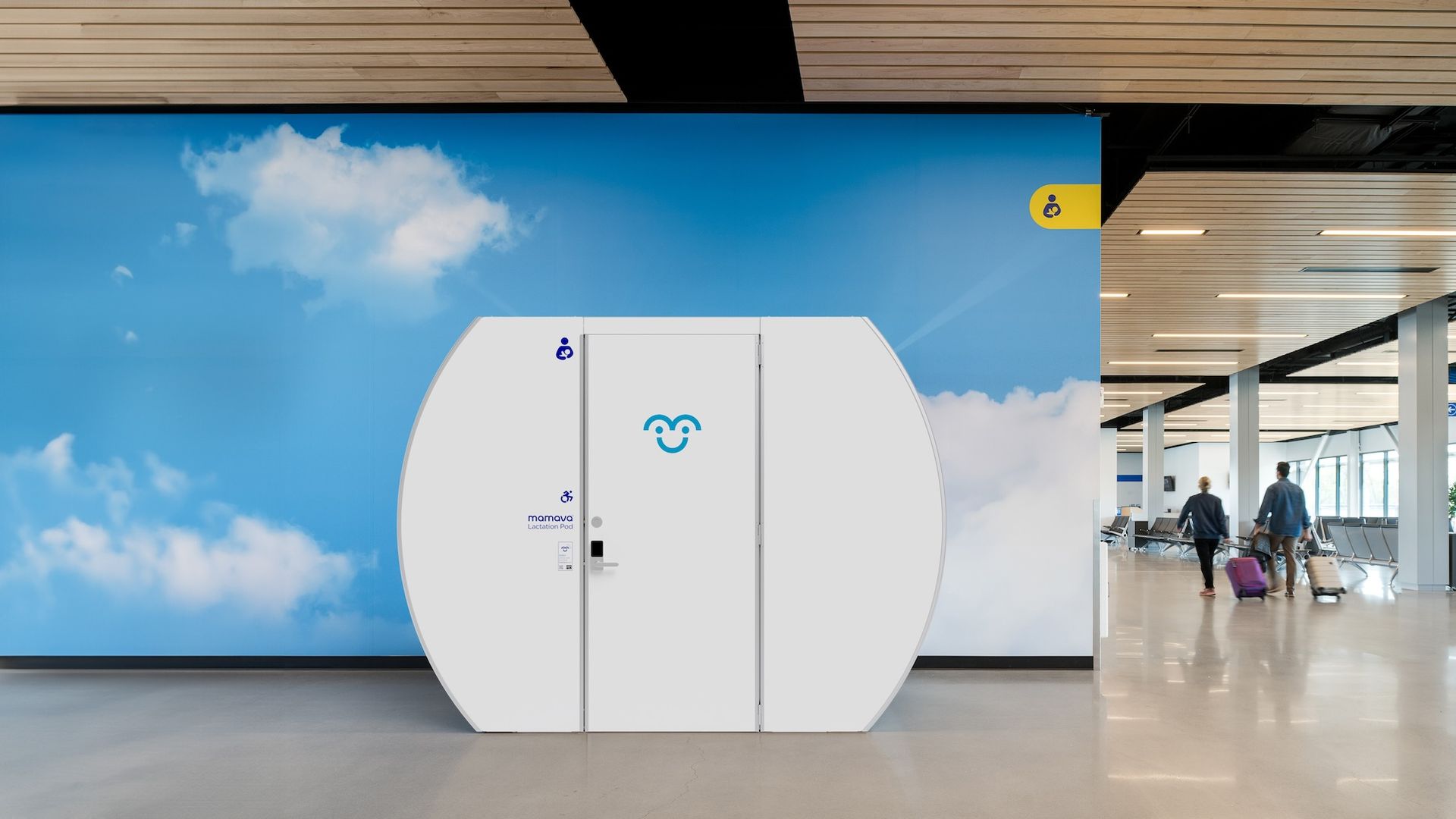 A blue sky background with a white, oval shaped pod with a door.