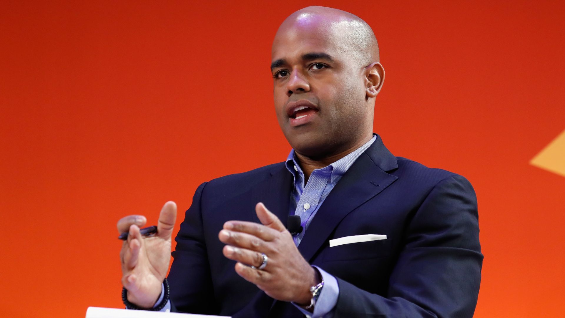 Jamal Simmons is seen speaking during a conference.