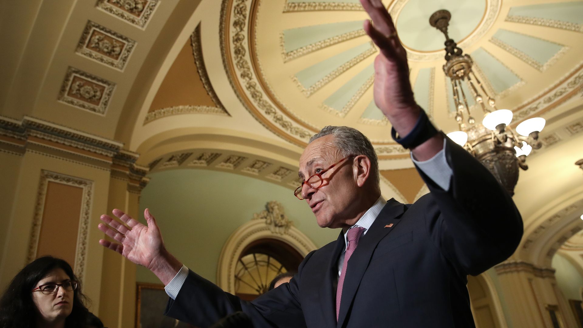 Sen. Chuck Schumer gesticulates during a speech