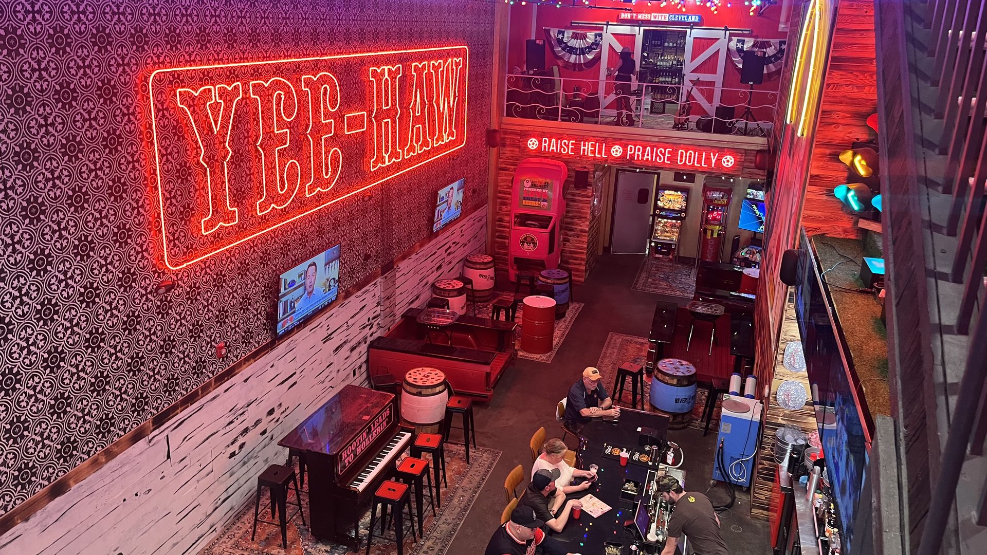 Inside of a country-themed bar with a neon 