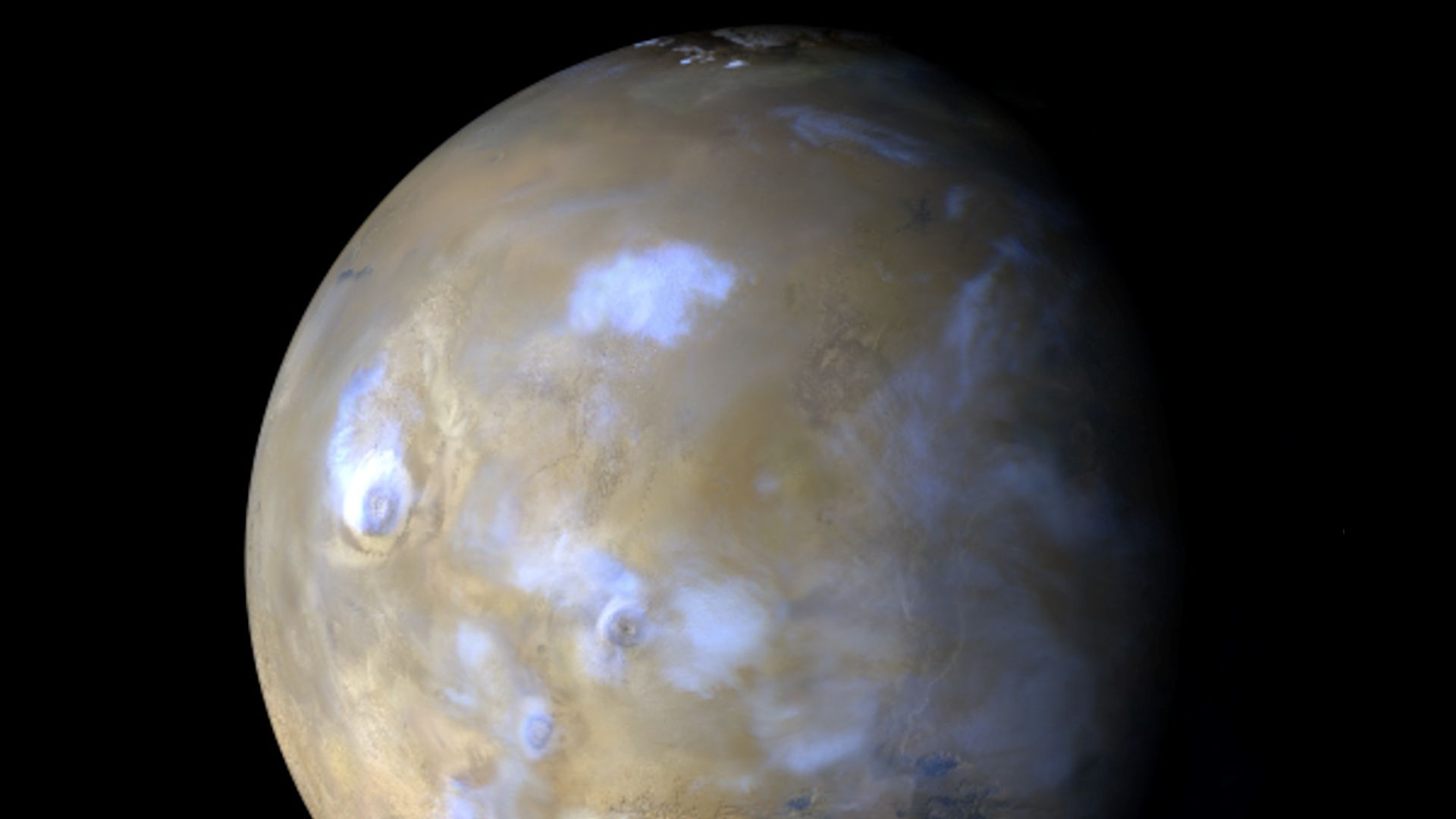 A full view of Mars and its storm clouds