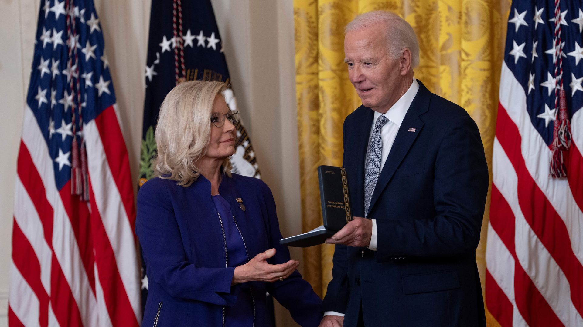 Former Congresswoman Liz Cheney receives the Presidential Citizens Medal from US President Joe Biden during a ceremony at the White House in Washington, DC, on January 2, 2025. 