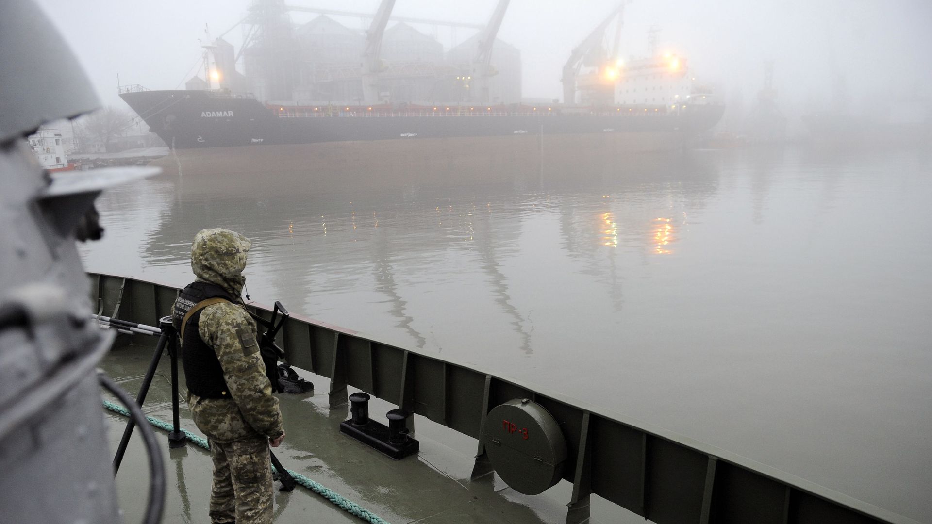 Ukrainian soldier stands guard aboard military boat called 'Dondass' moored in Mariupol, Sea of Azov port on November 27, 2018.
