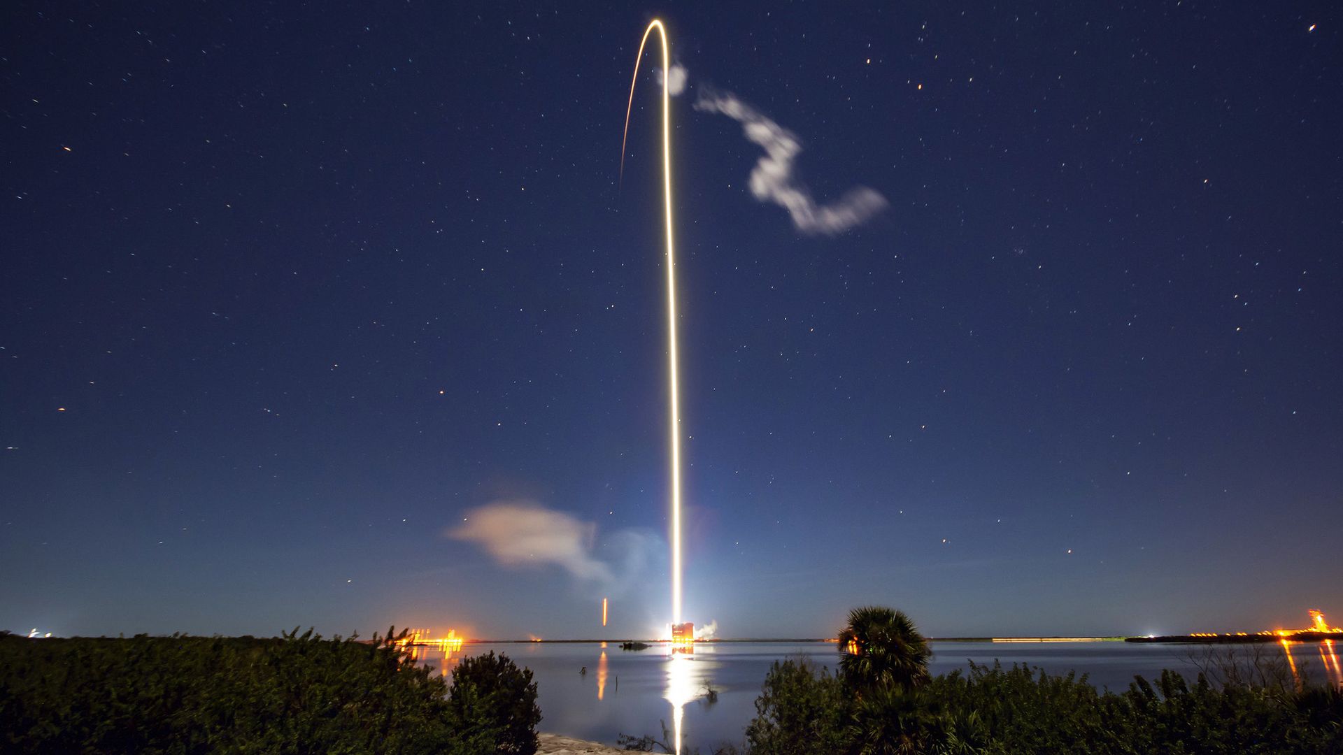 A streak of light into a darkened sky in Florida created by a SpaceX rocket launching a clutch of Starlink satellites to orbit