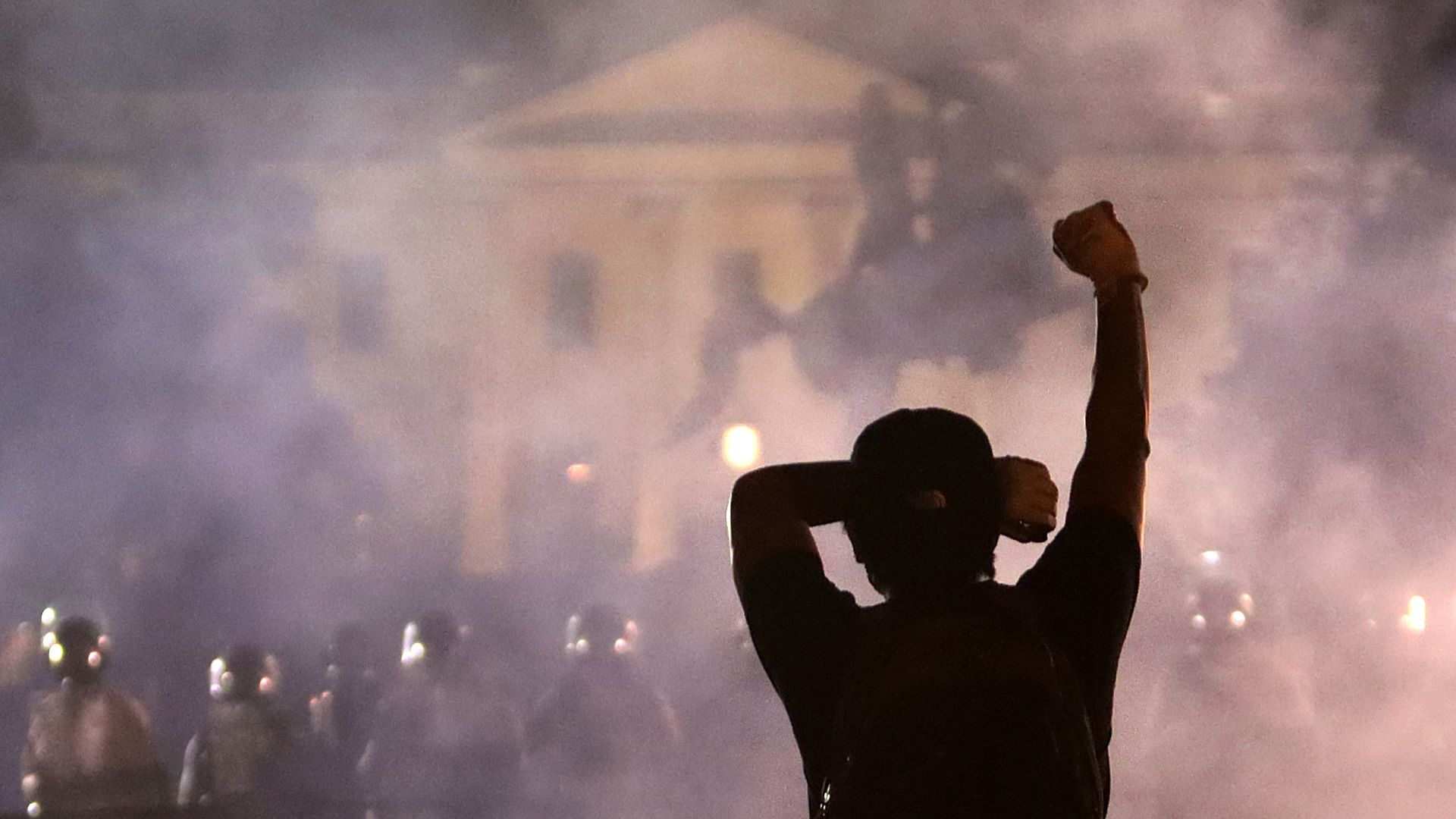 A man holds up his fist during a protest near the White House on May 31, 2020 in Washington, DC. 