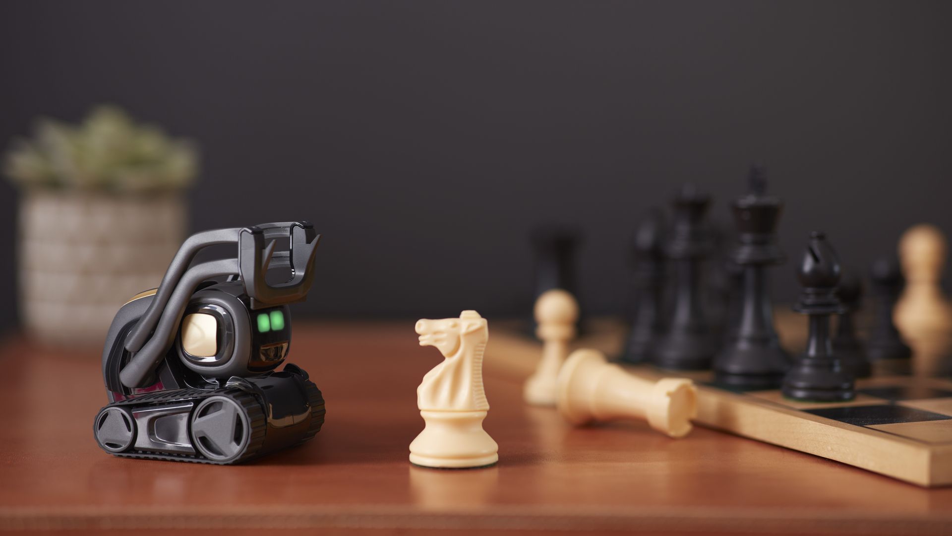 Anki's Vector robot, seen staring at some chess pieces