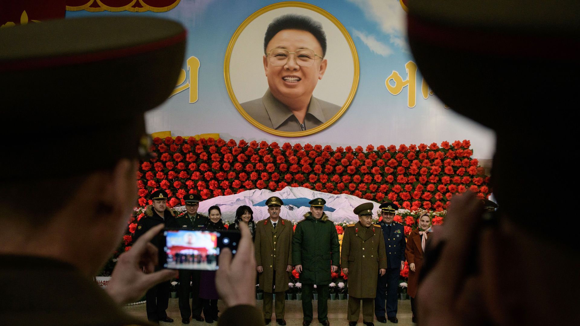 Soldiers from Russia, Iran, and China and North Korea pose for a photo before a display during a 'Kimjongilia' flower exhibition celebrating late leader Kim Jong Il, in Pyongyang