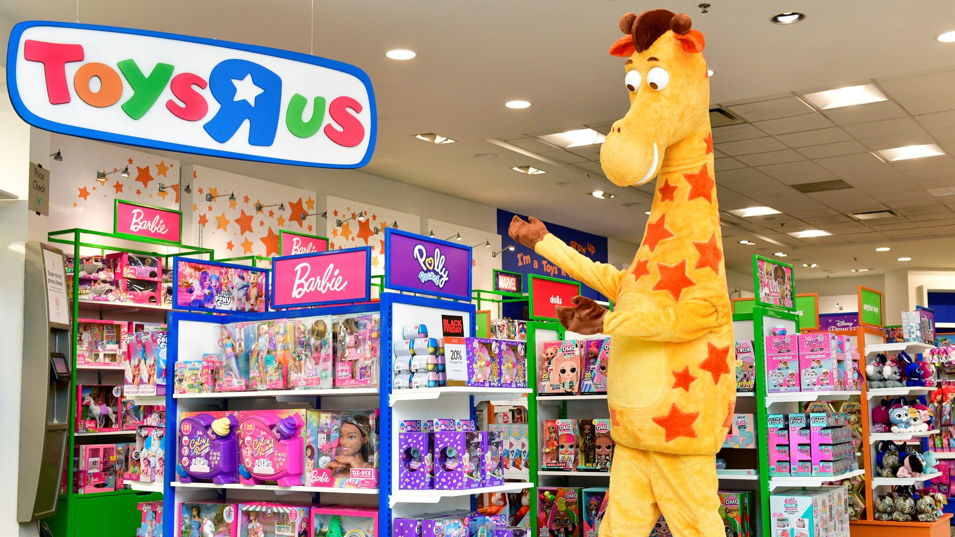 Toys R Us sign, toy displays and giraffe mascot