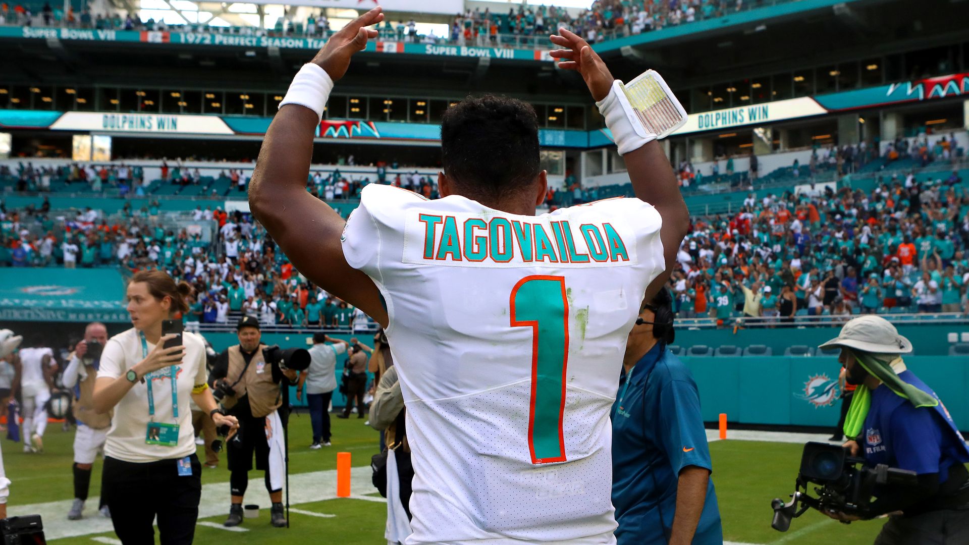 Quarterback Tua Tagovailoa #1 of the Miami Dolphins celebrates after his team beat the Buffalo Bills 21-19 at Hard Rock Stadium on September 25, 2022 in Miami Gardens, Florida.