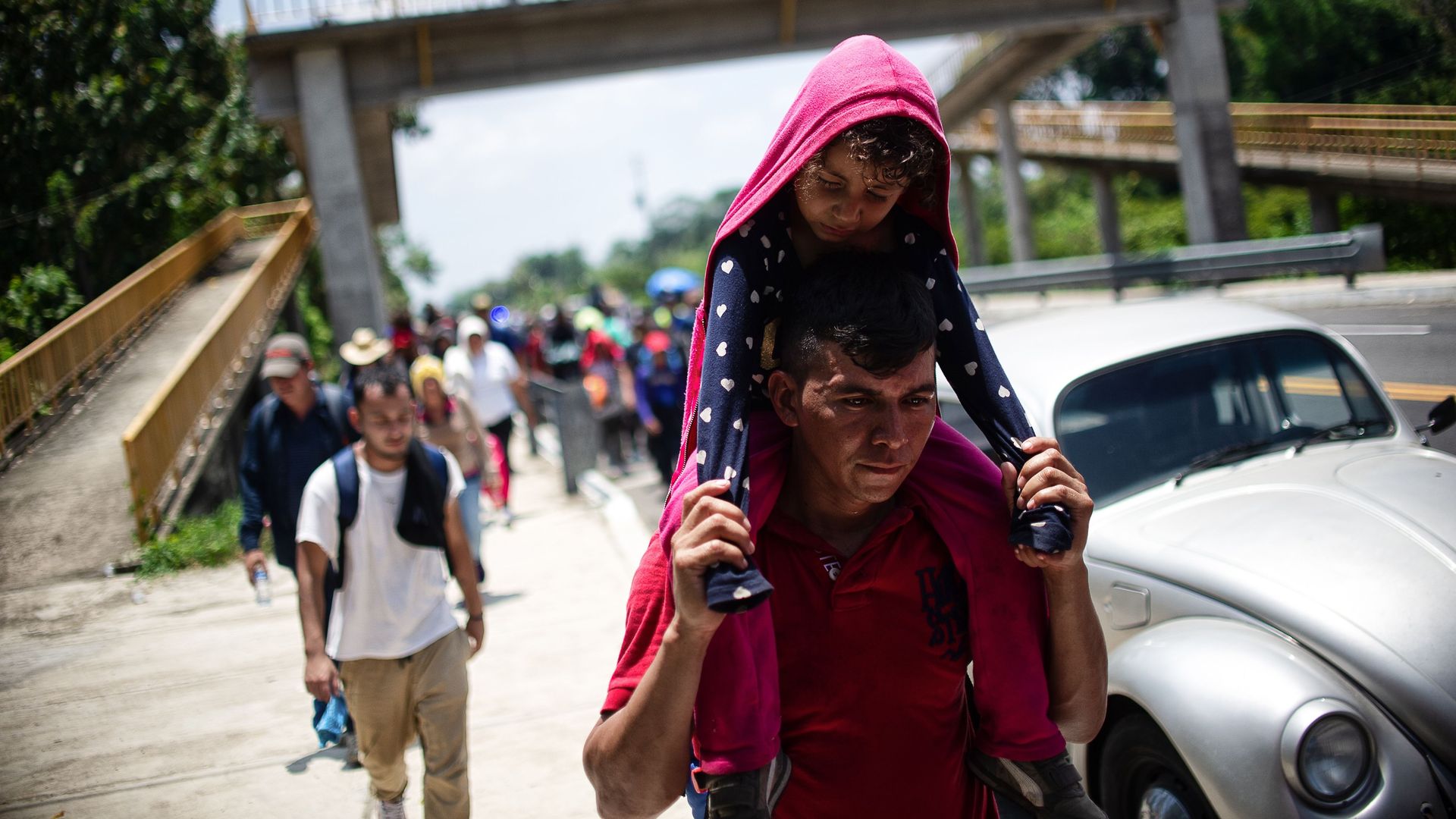  Central American migrants heading in caravan to the US rest beside the road between Metapa and Tapachula in Mexico on April 12.