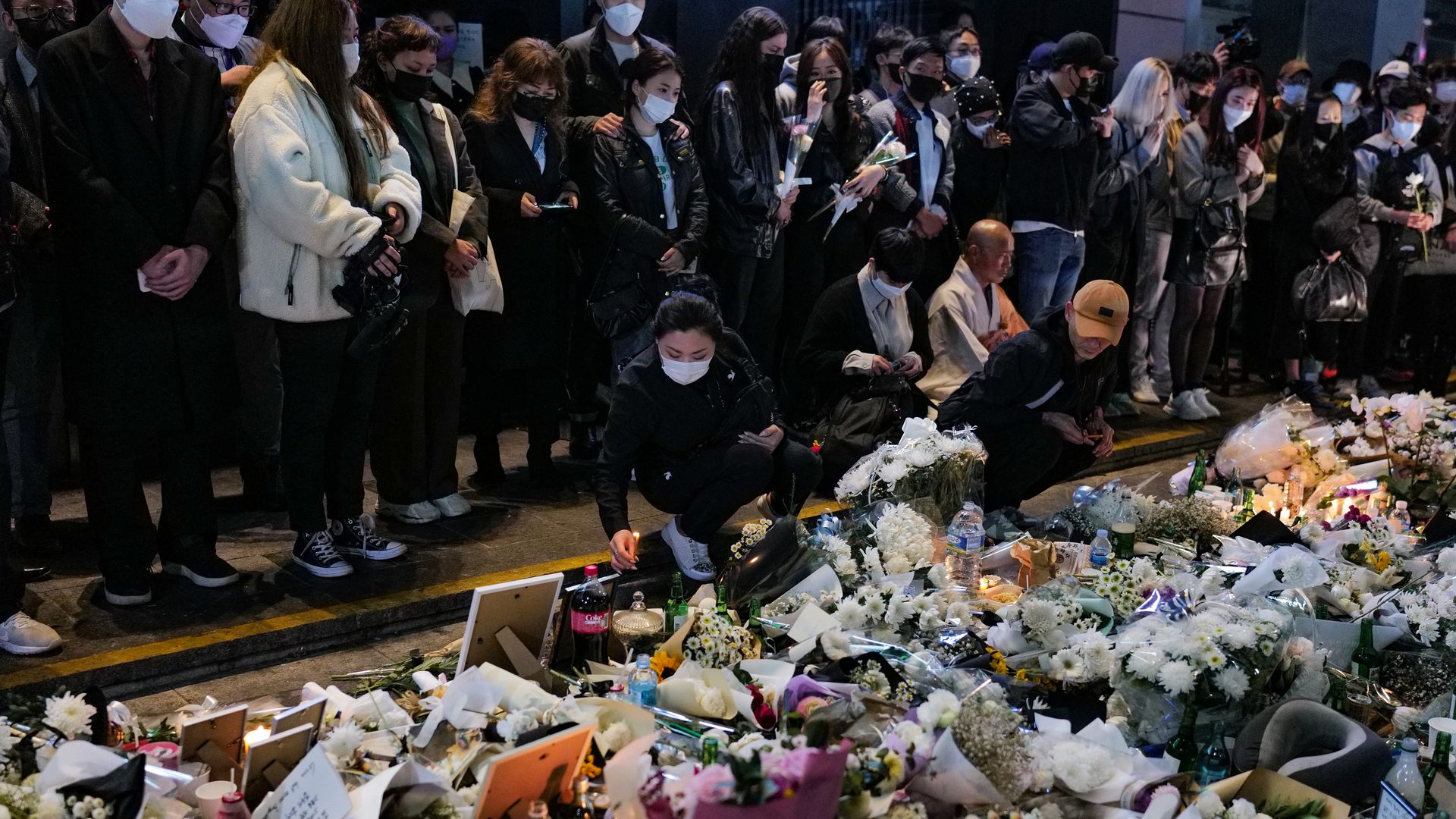 People pay tribute for the victims of the Halloween disasters in Itaewon on October 31, 2022 in Seoul, South Korea