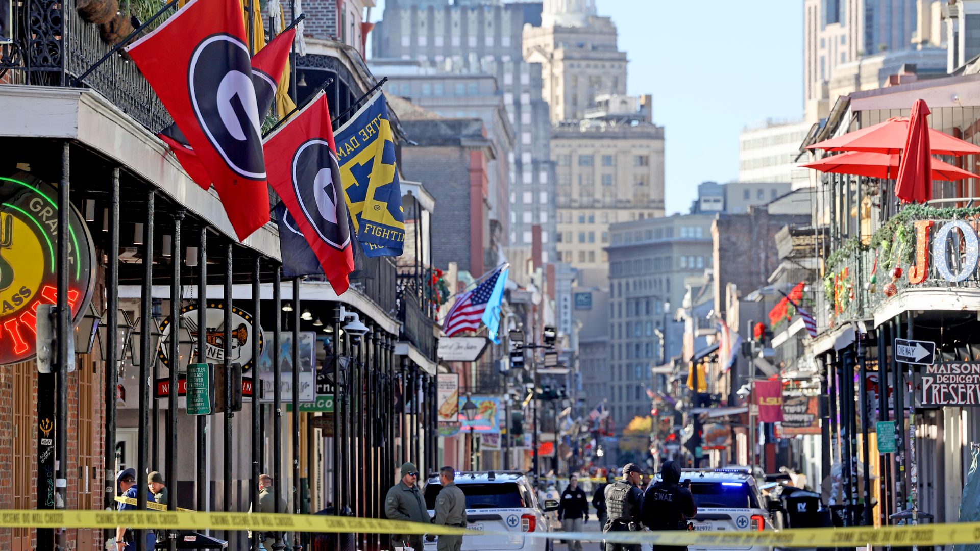 Law enforcement officers from multiple agencies work the scene on Bourbon Street after a deadly vehicular attack.