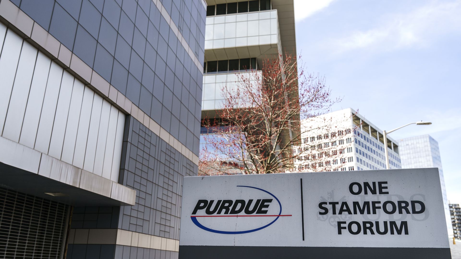 A sign reading Purdue Pharma outside of its headquarters building