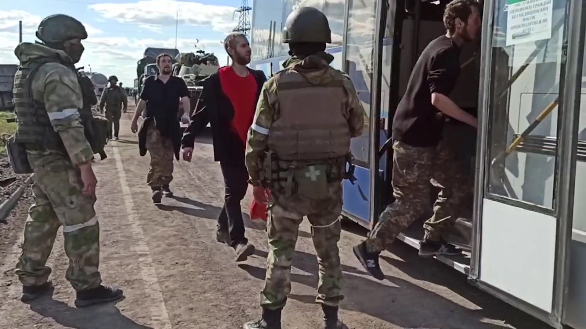 A screenshot taken from a video released by the Russian Defense Ministry shows Ukrainian soldiers being evacuated from Azovstal steel plant on Tuesday.
