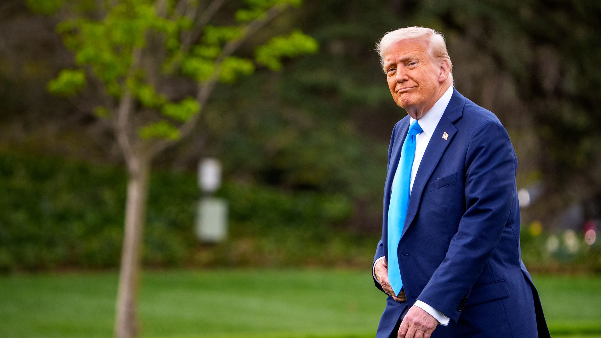 Trump walks on the South Lawn on his way to Marine One.