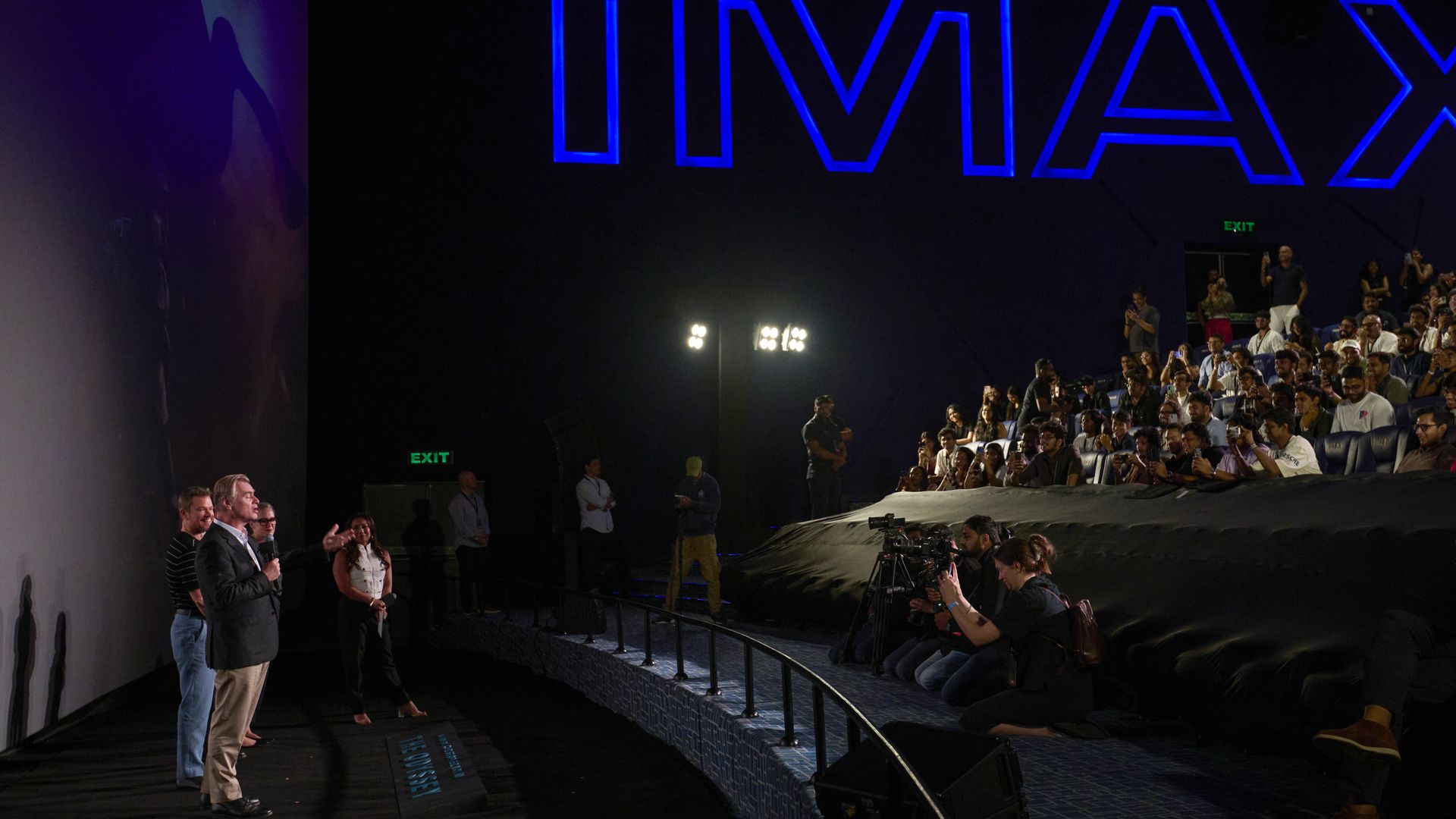 Christopher Nolan, Matt Damon and Emma Thomas attend an IMAX screening of "The Odyssey" in a Mumbai theater.