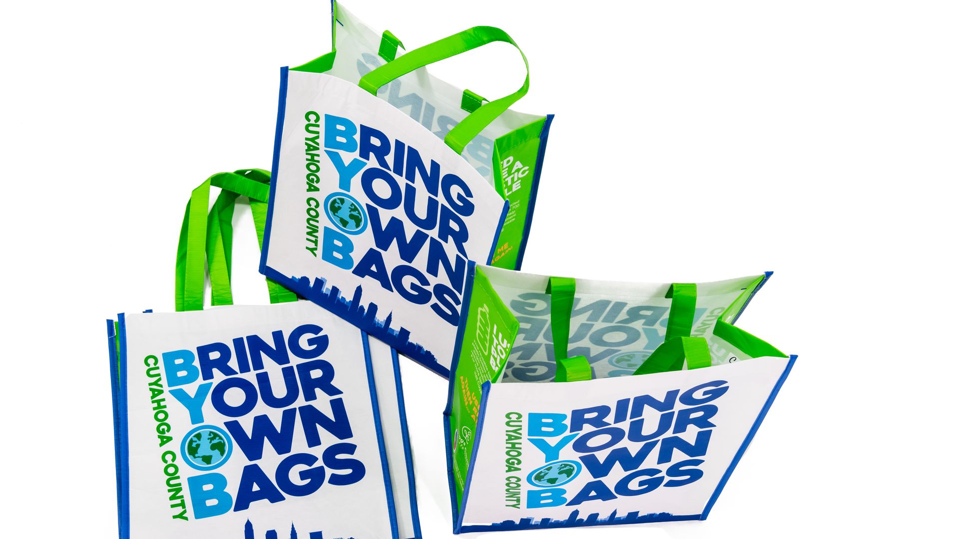 Three reusable bags with the text "Bring Your Own Bags" on the front