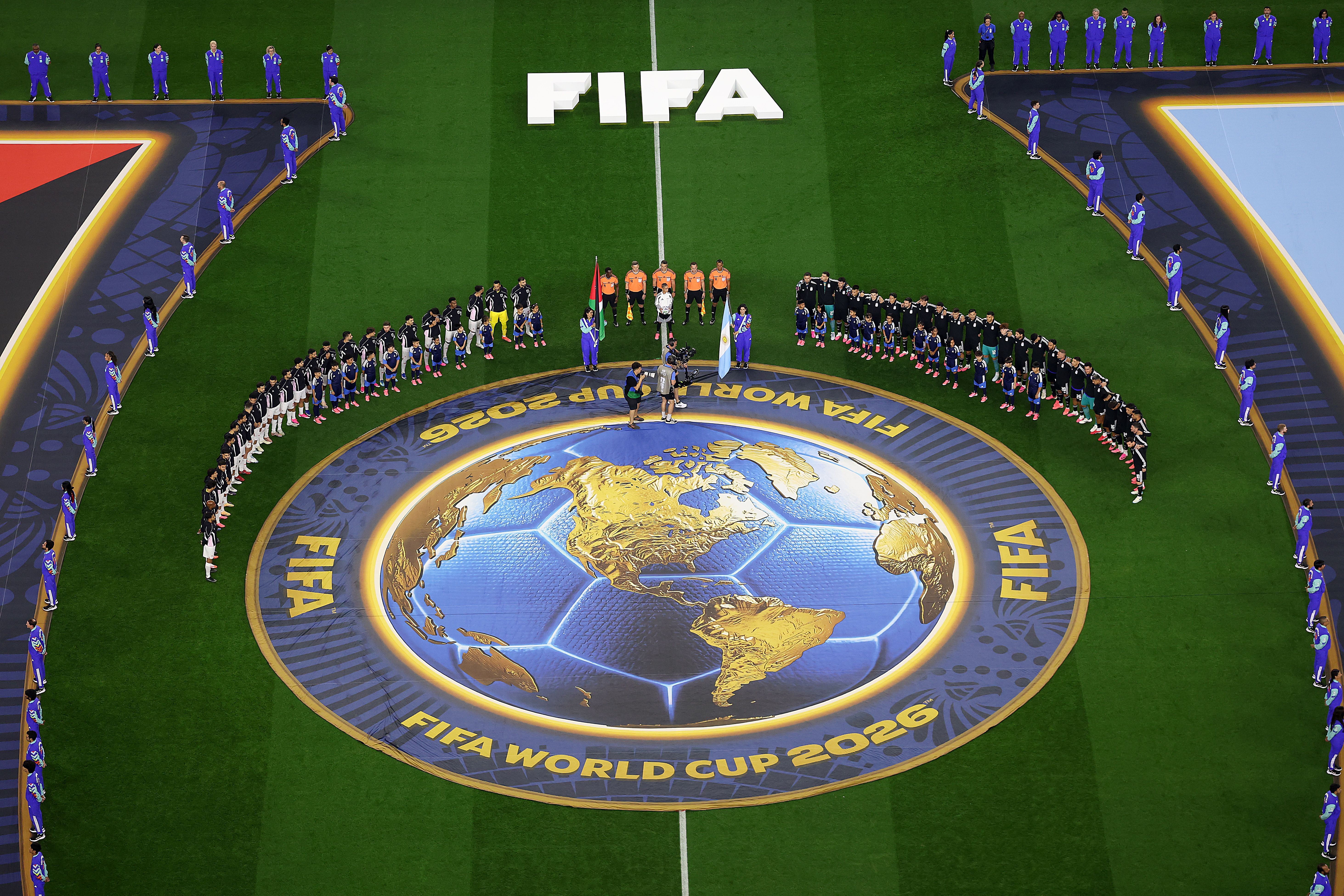 Argentina and Jordan's players stand in a half-circle with their countries' flags between them