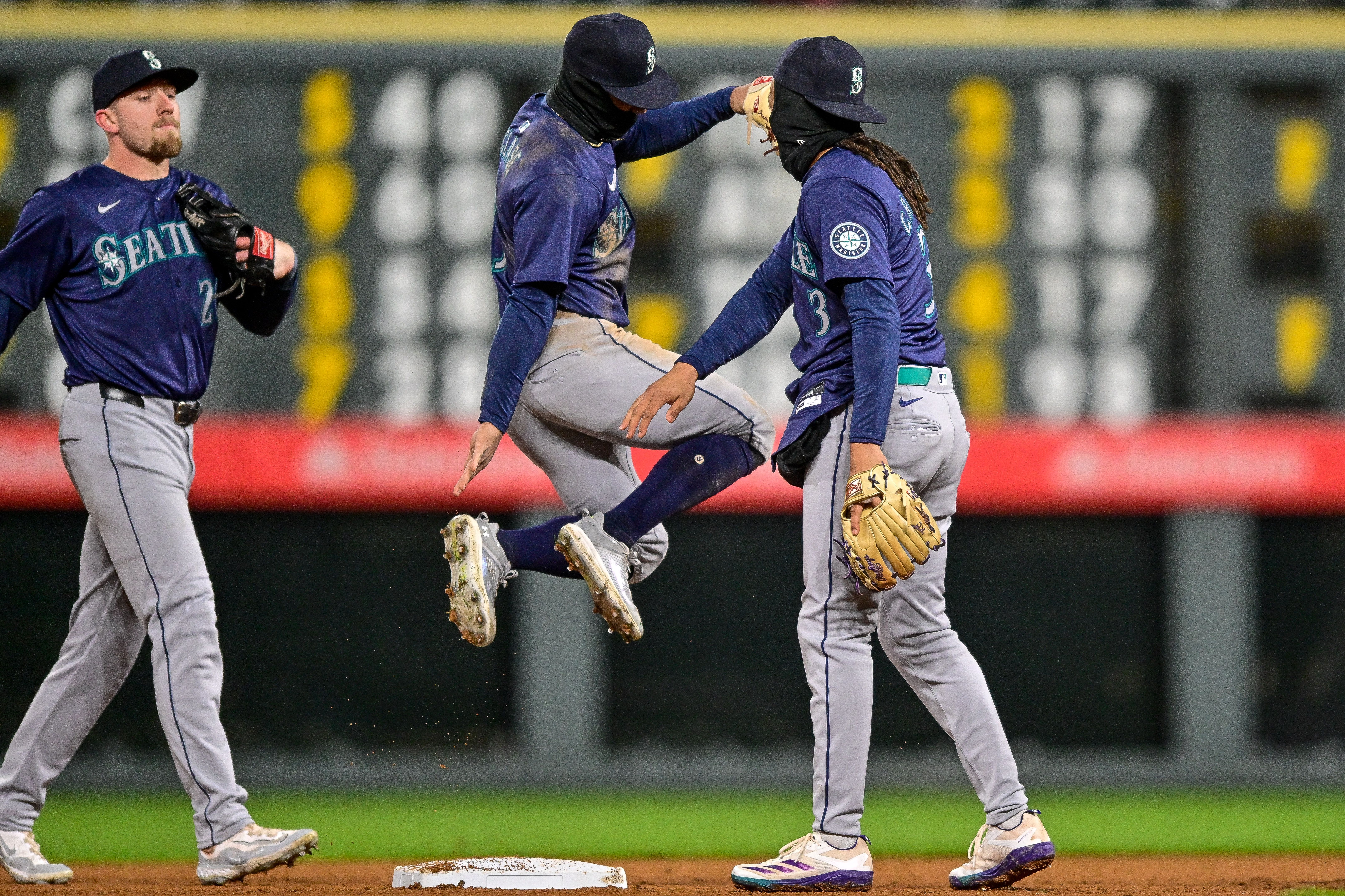 Mariners players celebrate after a win against the Rockies on Saturday. 