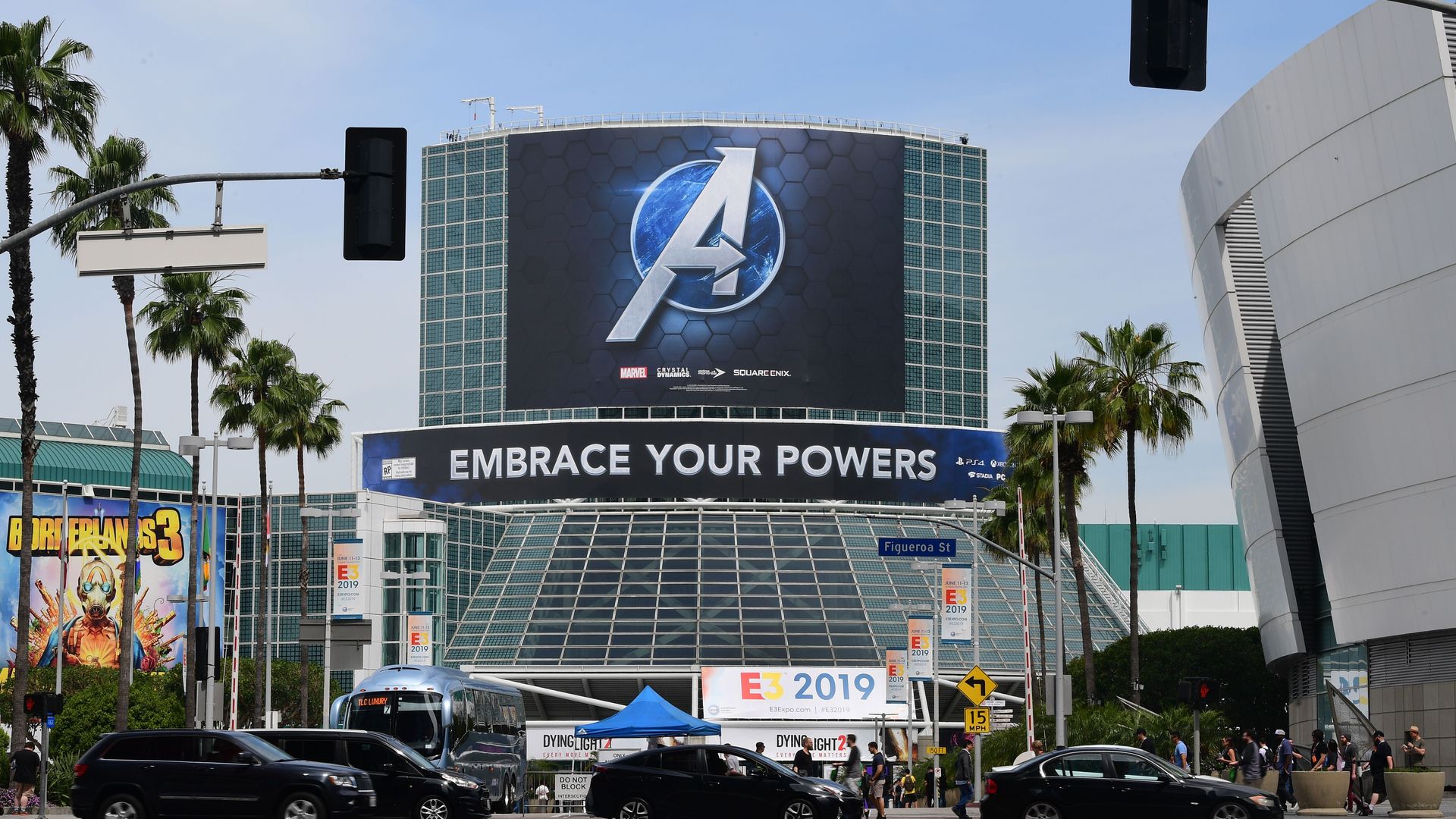 Photo of the Los Angeles Convention Center at daytime. The facade bears a logo for an Avengers game and has a banner for "E3 2019"