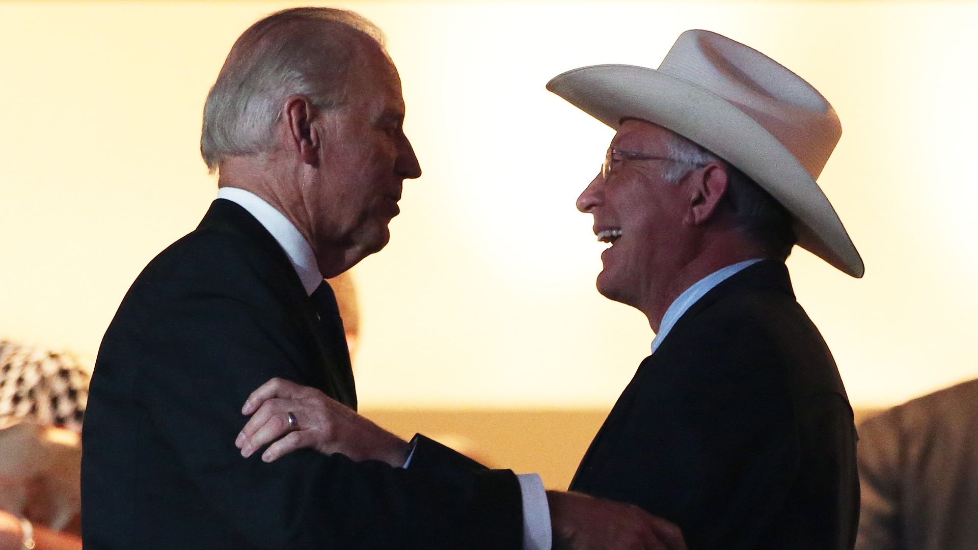 Joe Biden and Ken Salazar are seen embracing at the 2012 Democratic National Convention.
